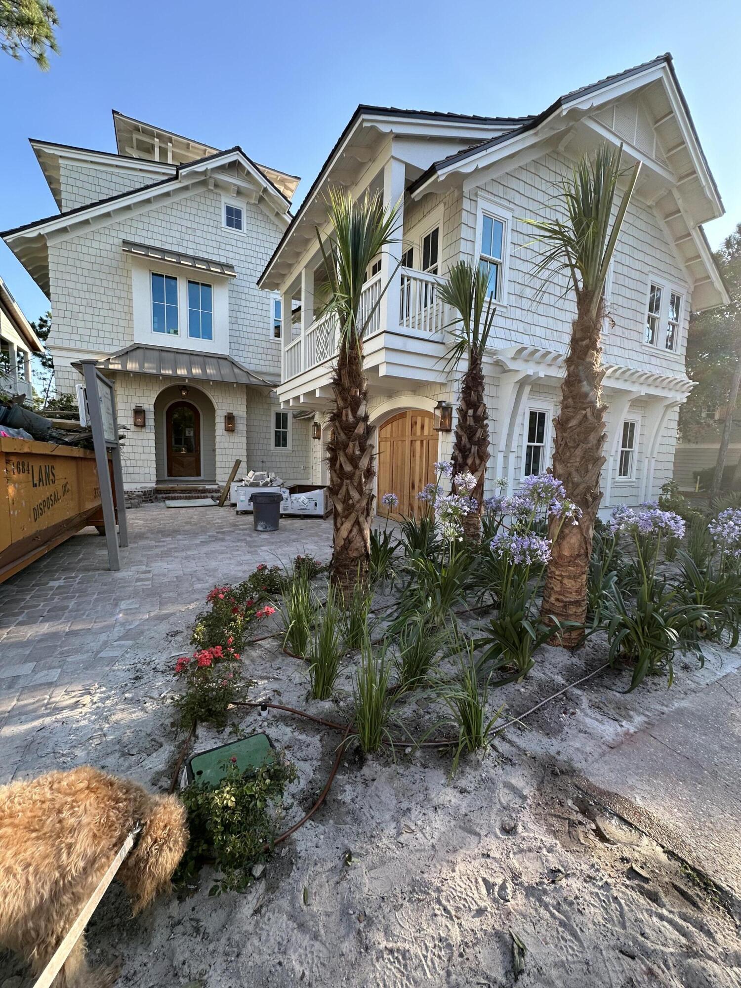 Exquisite new construction in the coveted WaterSound Beach community expertly designed by Gregory D Jazayeri and built by Borges Brooks Builders. Nestled on a prime corner lot overlooking a scenic pond, this majestic three-story residence boasts nearly 4,800 square feet with a 4BR/4.5BA primary home, a 1BR/1BA carriage home, a private heated saltwater swimming pool, a climate-controlled two-car garage, an elevator, and a fourth level tower with sweeping community and gulf views.Step inside to reveal a meticulous attention to detail throughout and the finest craftsmanship employed to create spaces that are equally stunning and functional.