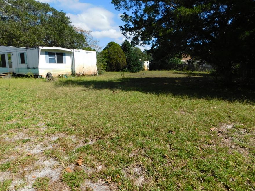 .99 Acre lot - just a few miles West of Hurlburt. Close to Beaches, Bases and Shopping! This is a Perfect site for building new homes! Many nice homes are nearby, including some new construction. This Lot may be suitable for a multifamily build or for up to three home sites. Mobile home on property conveys as is. Value is in the land, but Mobile home is salvageable. Call for more details. Feel free to drive by any time. Seller recently reduced price and does not want to pay any closing costs at this price.
