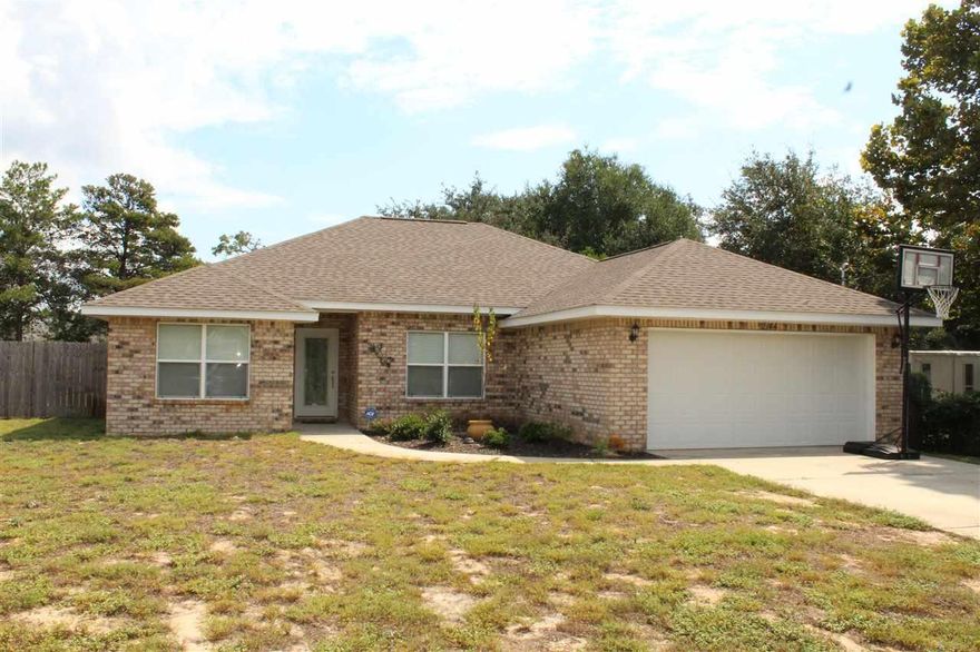 Wonderful Home situated on semi private lot.This home offers 4 Bedrooms and 2 full baths Single level Home. Home has 2 Car Front entry Garage, Granite,Tile,Brick and Vinyl outside features and Hardwood Floors. Close to shopping,Navarre Beach,Restaurants