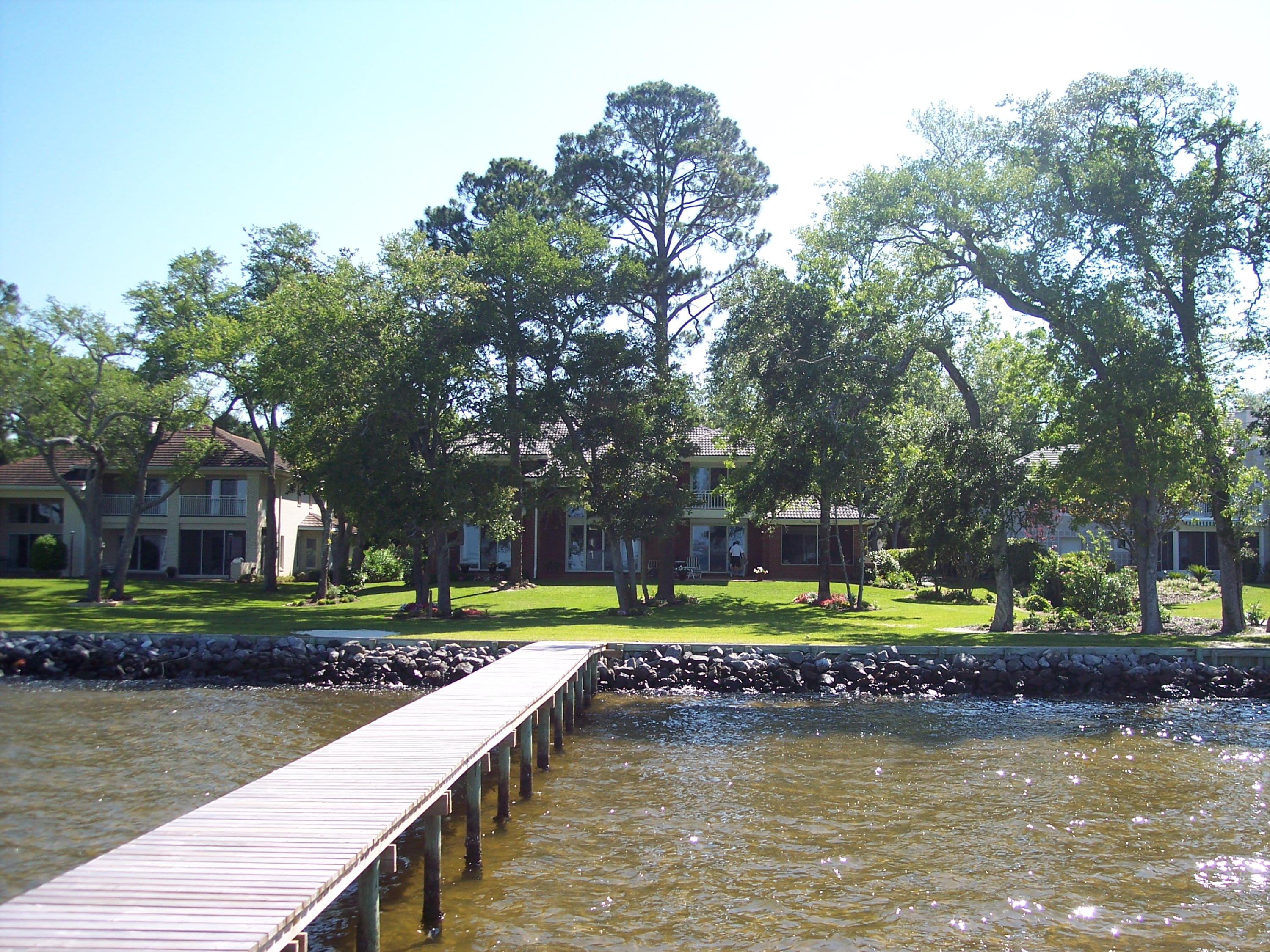 One of the Finest Waterfront Homes in the County .. This Custom Built all brick Home by Barton Homes features many upgrades throughout .. all rooms have a fantastic view over the Bay .. bedrooms have a patio or balcony open onto the water .. The owners use this as their second home .. just a few months each year .. property has been well maintained .. Raised ceilings throughout .. Tile roof ... electronic storm shutters .. security system .. concrete Paver driveway .. 4th bedroom could be easily added over the garage area .. A Must see home !!