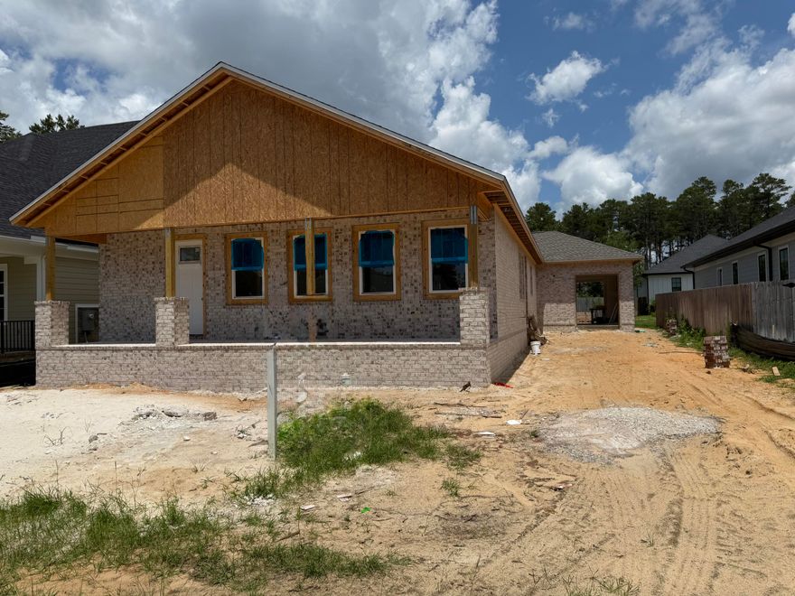 Under constructions, Stylish  Craftsman- style, One story home in DEER MOSS CREEK w/ oversized 2 car garage and a golf cart garage w/ 2 garage door access.  Situated in Ph 2 of the neighborhood.  Nicely designed, side yard and a southern style front porch for visiting w/ your neighbors. Desirable open floorplan, with vaulted ceilings in the main living room and a stylish, electric fireplace.  High end, Kitchen Aide appliances, quartz counter tops and solid wood cabinets.   Tankless hot water heater for on demand hot water. Spray foam insulation for energy efficiency. 3 beds and 3 Full Ensuite Baths. LVP flooring through out the main living space and tile floors in the baths. The DMC Community boasts amenities like sidewalks, a pool, clubhouse, small childrens park, half basketball ct ... gazebo.  Nature trails for walking and running that will continue over the future development of 1,100 acres planned community.  
