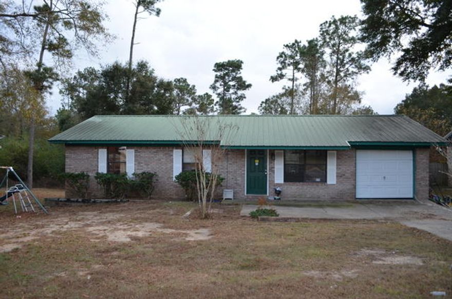 This REO home was built in 1990. Sitting on right at .42 acres this all brick home has metal roof, 1 car garage and is 1025 sf. Home has 3 bedrooms 1 bath. With a little bit of work, this home would be perfect for investors or first time home buyers who aren't afraid of a little sweat equity. Home may not qualify for all types of financing so please keep this in mind when viewing this home. Call today to set up your showing!