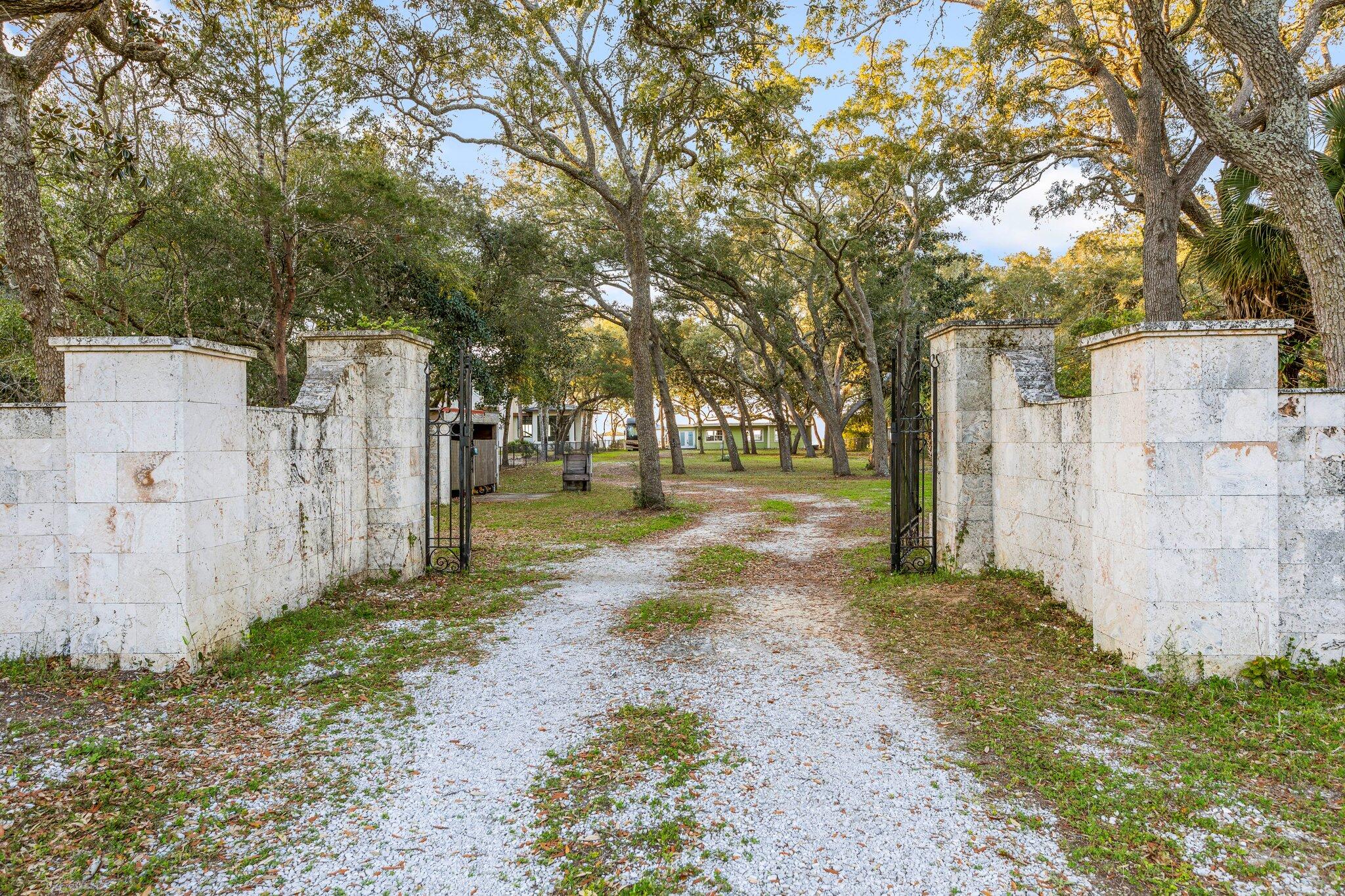FOR COMP PURPOSES ONLY ...Discover a rare waterfront treasure in Destin, Florida! This estate-size lot is a boater's paradise, minutes away from the Gulf waters, bay, and intercoastal waterways. Tucked behind gated entry, you'll be enclosed by the serenity of mature live oaks leading to the water's edge. Included on the property is a one-story block home and waterside gazebo, both offered AS IS. The true value lies in the land, presenting a canvas for your waterfront dream home. With a new dock installed in 2023, this property is primed for waterfront enjoyment. The breathtaking views offer a front-row seat to the most beautiful sunrises and sunsets. Experience the beauty of waterfront living - this opportunity awaits you.