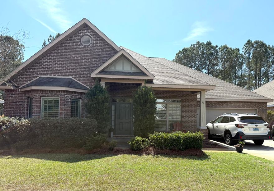Upgraded features throughout this McKenzie floor plan. One of the larger preserve lots in the neighborhood of Whispers! 5bdr,3bath w/office. Over $75k in upgrades! This spacious home has Designer window treatments- Plantation shutters and blinds throughout. Split floor plan ensures privacy in all 5 bdrs. The living area has dbl trey ceiling, crown molding and stacked stone gas fireplace. Dining Rm has trey ceiling. Large Kitchen w/island and breakfast area overlook living area and sunroom. Granite countertops in kit and baths. Custom hardwood flooring and light fixtures throughout. Tiled sunroom overlooks the high ceiling screened porch. A deep backyard extends back to the wooded preserve providing privacy. Low maintenance Brick exterior. Enjoy using the wonderful amenities of Hammock Bay.