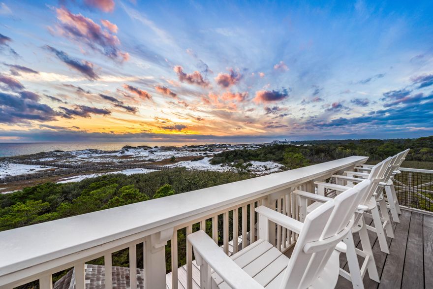 Positioned along the pristine shores of the premier WaterSound Beach community, this one-of-a-kind GULF FRONT haven presents the epitome of coastal elegance. A four-bedroom primary home and a two-bedroom guest house encompass nearly 6,200 square feet of impeccably designed interior spaces while a spacious outdoor courtyard offers a private pool, spa, and lounge area with firepit. From the moment you enter the residence, the meticulous quality of construction is apparent with luxurious finishes throughout including Venetian plaster walls, pecky cypress cabinetry and walls, custom millwork, beamed ceilings, brick accent walls, custom tiled bathrooms, hidden closets and so much more. The first level of the home offers the ultimate gathering space with a secondary living room with multiple seating areas, a gorgeous pecky cypress bar with Asko dishwasher, icemaker, and a Sub-Zero miniature refrigerator. There are also a guest suite with ensuite bathroom and a bunk room with four built-in bunks and an ensuite bathroom. Open and screened porches provide additional spaces to enjoy on the first floor.

Ascend to the second level via the custom staircase or elevator for added convenience. This grand space encompasses the primary living spaces with a gourmet kitchen, wine room, living room, dining room, and a spacious covered porch with summer kitchen and fireplace. Highlights of the kitchen include marble counters, custom cabinetry, a Cove dishwasher, Wolf gas range with hood, and Sub-Zero refrigerator and freezer while the wine room offers built-in storage, a Sub-Zero wine fridge, beverage center and icemaker. An elegant guest suite with ensuite bathroom is also located on the second floor plus a powder room. Connected to the main house via a unique glass catwalk is the sizable guest home. It includes a sitting area, two bedrooms and a full bathroom.

On the third level, find the primary suite with spectacular views across the breathtaking natural sand dunes of WaterSound Beach. A separate sitting area, pecky cypress walls, incredible ensuite which includes a television in the mirror, built-in office, morning bar with Sub-Zero wine refrigerator and icemaker, and private porch with gulf views make this a truly luxurious owner's retreat. On the top floor, find the crowned jewel with a cozy sitting area with pecky cypress walls and ceilings and exterior porch all with magnificent Gulf views.

Follow a wooden boardwalk winding through picturesque dunescape directly to the beach from this residence. Outstanding community amenities including swimming pools, a puttering park, community green space, and a state-of-the-art fitness center are steps away. This stunning gulf-front home is a masterpiece of design, seamlessly blending modern sophistication with the natural beauty that defines the 30A Gulf Coast and offers a one-of-a-kind opportunity for the most discerning buyers.