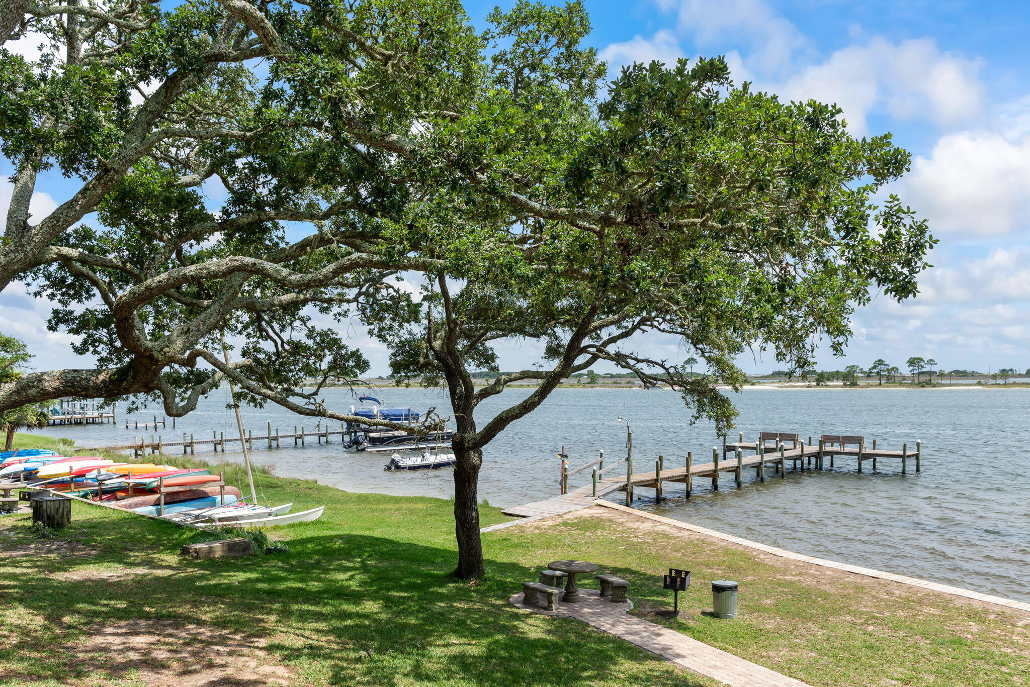 Interior pictures coming soon Enjoy your little piece of paradise at The Ceder's! Waterfront Florida living at a great price! You'll have access to a beautiful pool, private beach, boat dock, BBQ grills, kayak racks and a serene courtyard all situated in a wonderful location just minutes from the bases, and the beautiful beaches of the Gulf of America and shopping. This is a great opportunity to call home OR your home away from home.