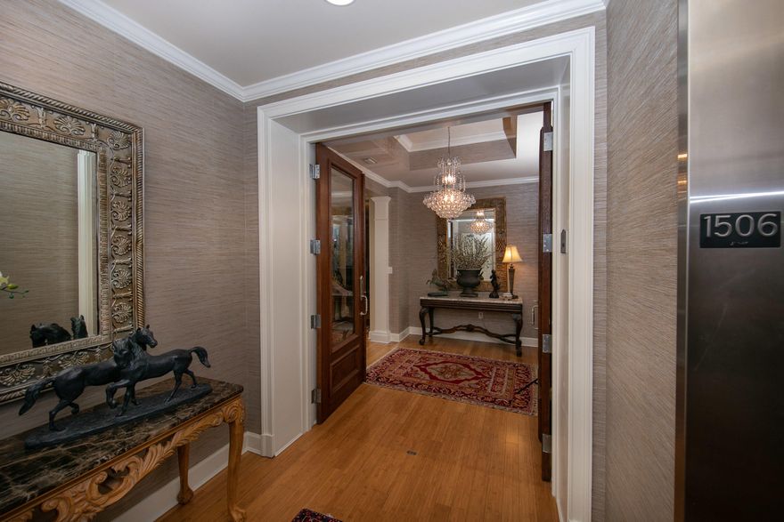 Highly coveted ''Edgewood'' floor plan with many upgrades and fine finishes. Kitchen is equipped with custom built cabinets along the northern wall, pull out drawers and soft close cabinets. Third bedroom used as an office/den, has a custom built-in office with granite credenza, and fine hutch with shelving.The residence offers panoramic views to the West, with both Gulf and Bay vistas, boasting year round sunsets.Two separate HVAC units allowing the home owner true climate control in the master quarters and the remaining living areas. A ''two way'' fireplace divides the dining and living area. Custom Bamboo flooring spread throughout(aside from guest room) is a perfect compliment to the special lighting, grass cloth wall paper, window treatments & fresh paint. Parking is close to ent