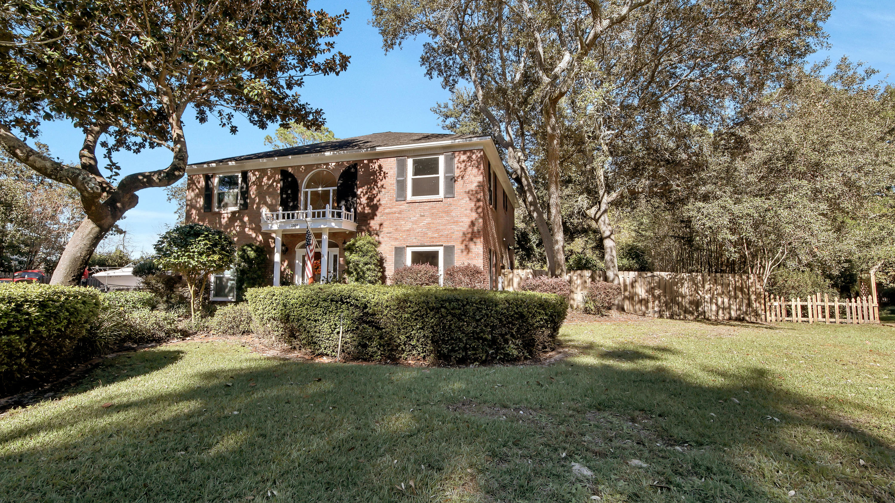 This beautiful two story traditional brick home is located in the gated community of Windward in Bluewater Bay! This charming waterside neighborhood offers a private beach area and dock to enjoy evening sunsets, fishing, and the perfect location to launch your kayak or paddle board. This spacious five bedroom home is situated on .43 acres and includes an in ground pool bordering a serene nature preserve. Offering a three car garage large enough for a workshop, gym and a car! The first floor of this home includes your living area, kitchen, dining, guest bedroom, laundry, mud room, and glassed in Florida room. The second floor includes your master bedroom, three guest bedrooms and three bathrooms. The Bluewater Bay Resort offers golf, tennis, walking trails, restaurants, and marina