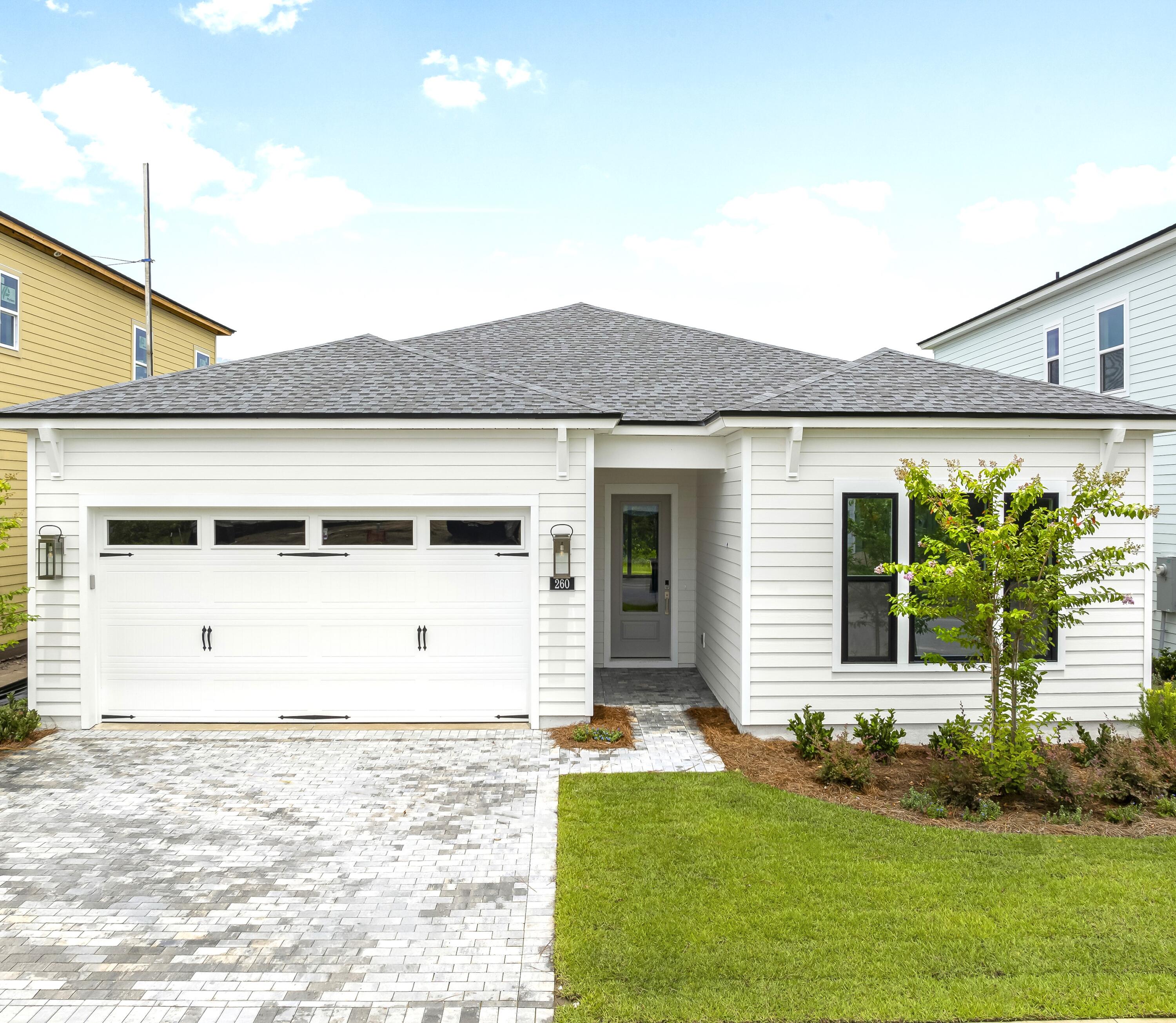Beautifully designed new construction single-story home, ready for quick move-in! Featuring 3 spacious bedrooms, 2 full baths, and a versatile bonus room perfect for a home office, study or media space, this home backs up to serene, private woods--offering a peaceful retreat right in your backyard.Enjoy high 10' ceilings and seamless luxury vinyl plank flooring throughout home, with elegant tile in the bathrooms for added style and durability. The gourmet open kitchen is a chef's dream, complete with quartz countertops, premium cabinetry, tile backsplash, and a large island ideal for entertaining. The primary bathroom has duel vanity with quartz countertops, walk-in tile shower with frameless glass door, large soaking tub and spacious walk-in closet. Paver driveway and paver covered lanai. Located in a gated community with resort-style amenities, this home offers access to a pool, fitness center, clubhouse, tennis court, pickleball courts, playground and more all just minutes from the gorgeous beach, Pier Park dining, shopping and fun entertainment, trails and parks, NW FL Beaches International Airport, Frank Brown Park, future FSU/TMH Medical Campus, and future Watersound West Bay Center. Experience coastal living at its finest with privacy, luxury, and convenience wrapped into one stunning property. Construction is complete available for quick move-in.