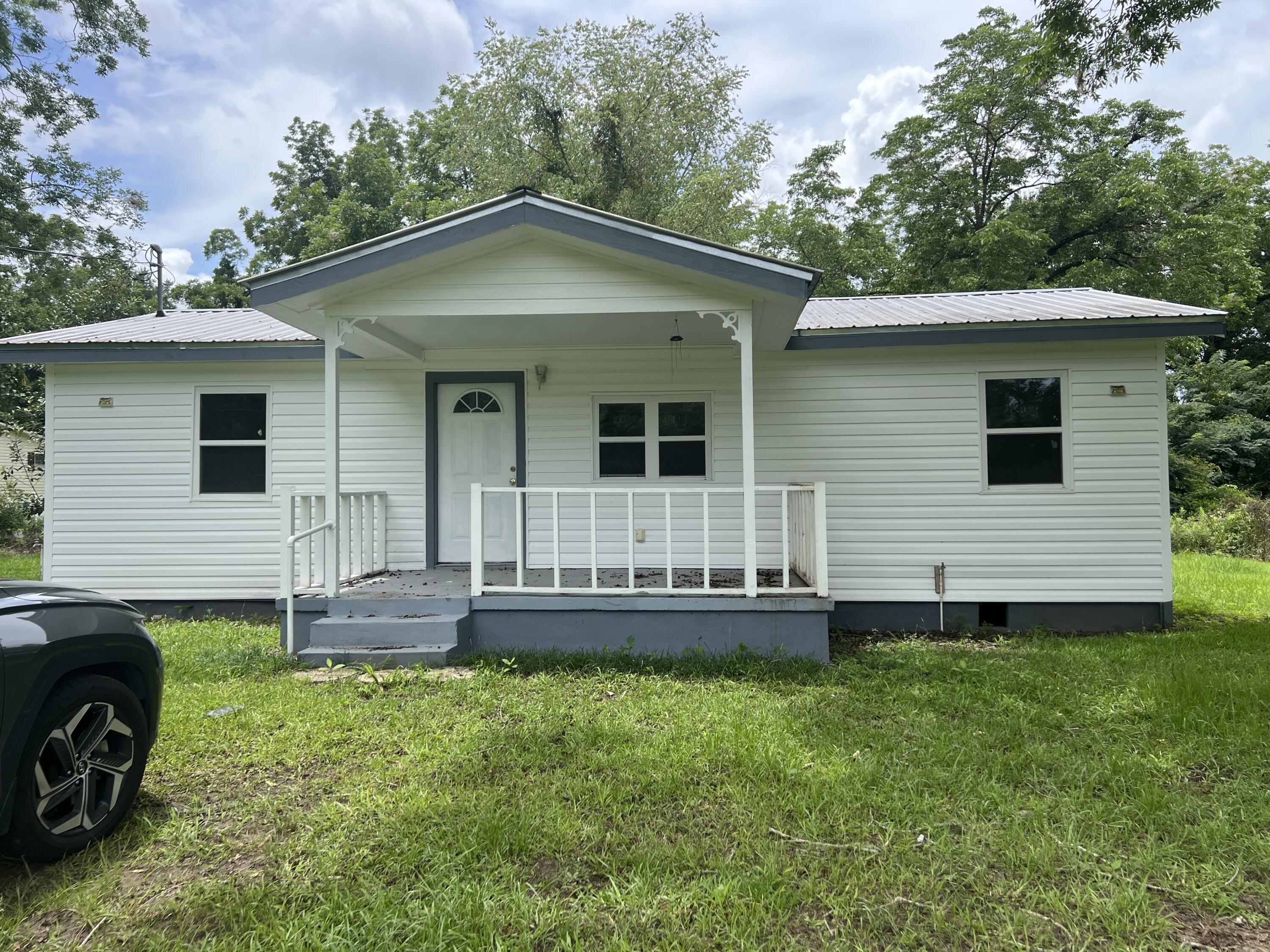 This home is perfect for the first time home buyer or rental. It has been renovated with new LVP flooring, new bathrooms, new paint, new windows, and updated kitchen with butcher block counters. There is new wiring and a newer metal roof. The HVAC and water heater are new also! All this for a great price! Easy to show and even easier to love! Make an appointment to see this home soon because at this price this one won't last long!