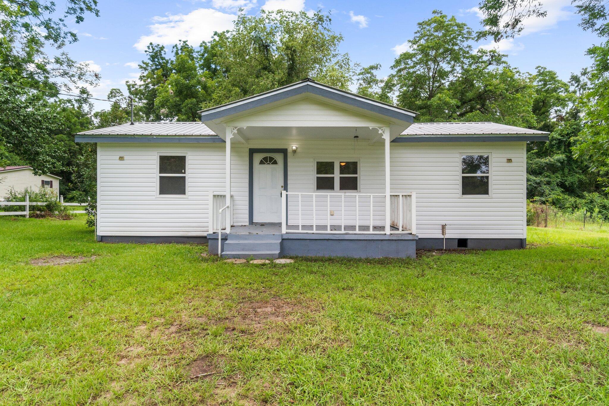 This home is perfect for the first time home buyer or rental. It has been renovated with new LVP flooring, new bathrooms, new paint, new windows, and updated kitchen with butcher block counters. There is new wiring and a newer metal roof. The HVAC and water heater are new also! All this for a great price! Easy to show and even easier to love! Make an appointment to see this home soon because at this price this one won't last long!