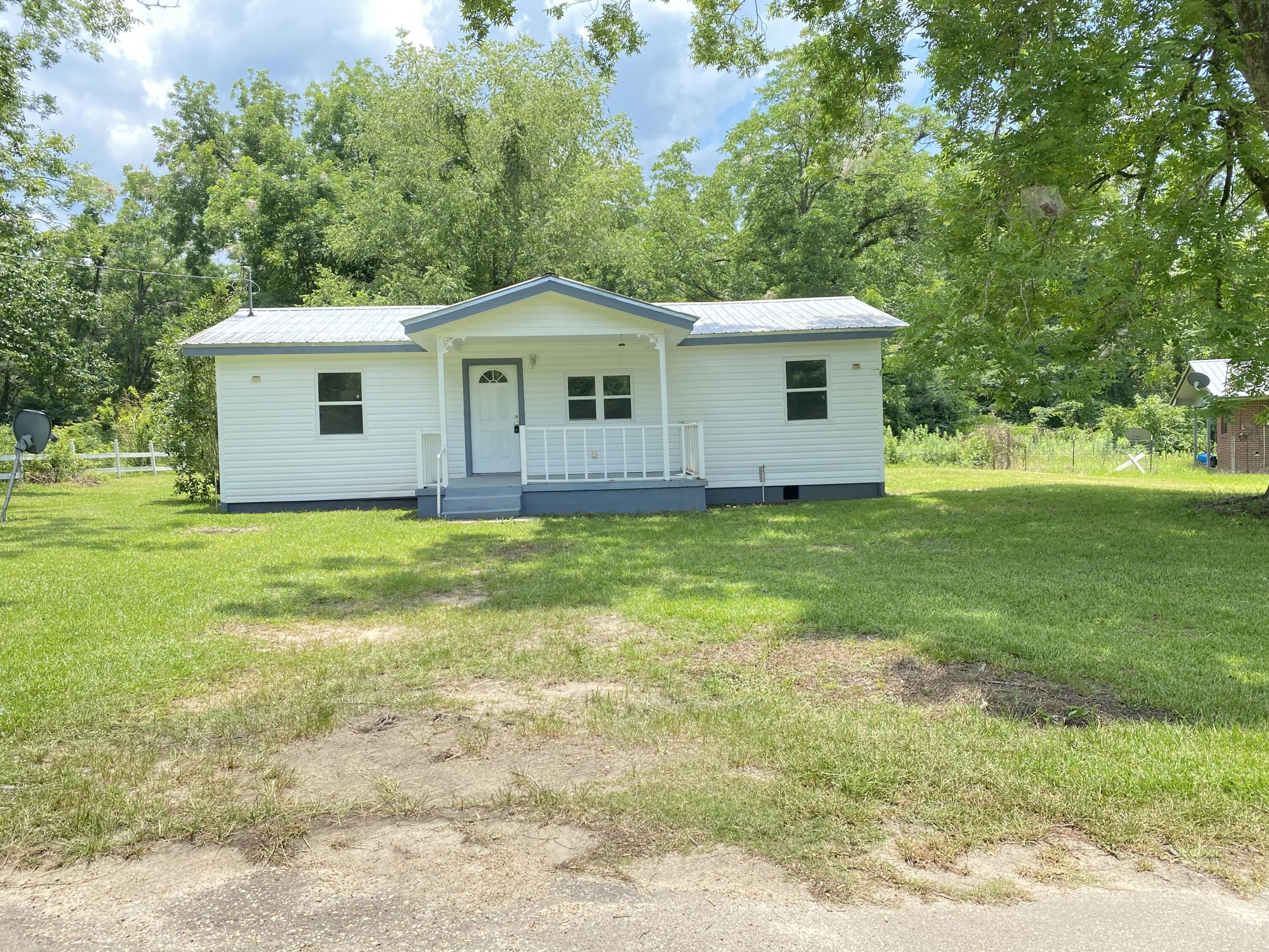 This home is perfect for the first time home buyer or rental. It has been renovated with new LVP flooring, new bathrooms, new paint, new windows, and updated kitchen with butcher block counters. There is new wiring and a newer metal roof. The HVAC and water heater are new also! All this for a great price! Easy to show and even easier to love! Make an appointment to see this home soon because at this price this one won't last long!