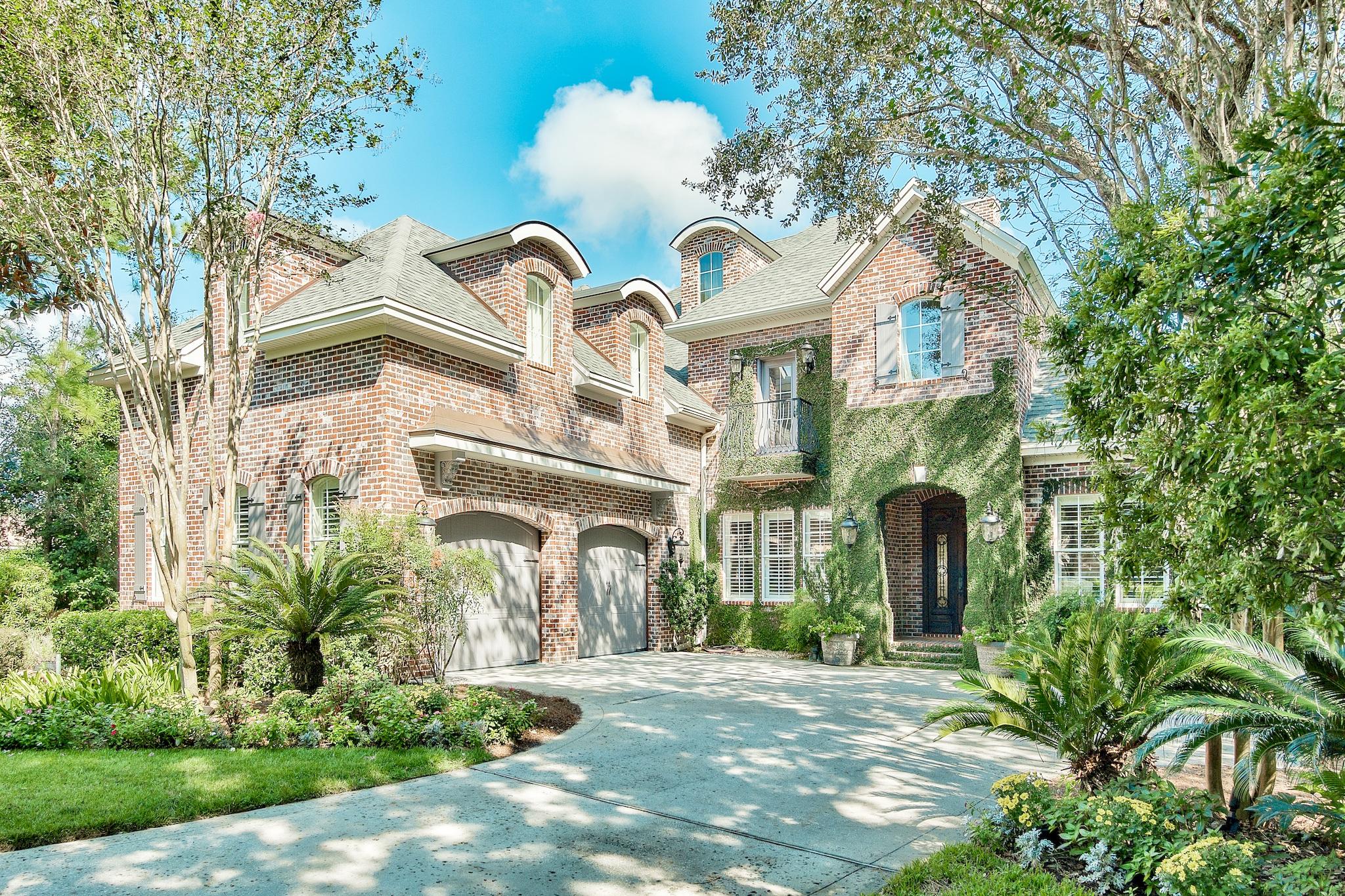 This exceptional Kelly Plantation home was custom built by Randy Wise Homes and awarded Best Overall Home by the BIA of Okaloosa-Walton Counties. You'll enter this exquisite residence through its 100-year-old antique doors into an open floor plan with hand scraped distressed hardwood floors. Natural light fills the home and highlights the property's architectural details. Beyond the living area is an outdoor oasis with heated pool and spa surrounded with lush landscaping all within a 2000 sq ft courtyard and screen enclosure. The home features a whole house generator, 600 bottle wine room, gourmet kitchen, art studio, private office, and media room. Its mature landscaping frames the private setting overlooking Lake Rangia.