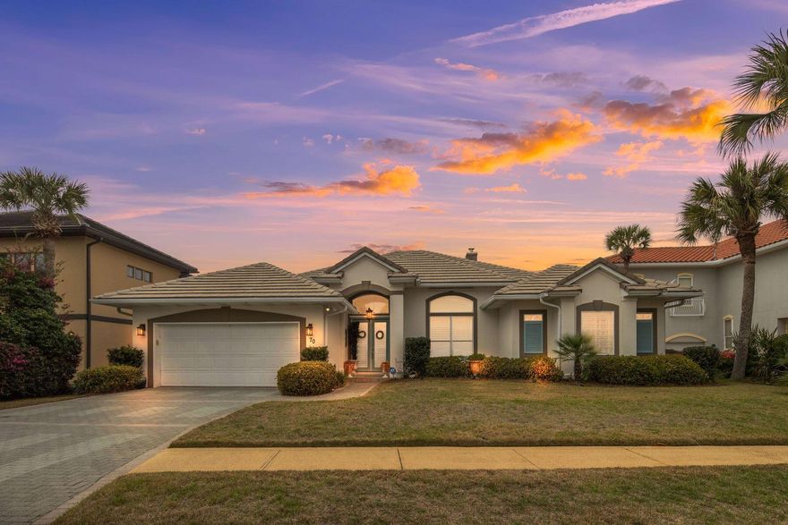 Only a short stroll from the gulf and set along a quiet cul-de-sac south of Highway 98, 70 Siesta Bluff offers a refined coastal lifestyle in a beautifully maintained Mediterranean residence. Located within a gated community and approximately 1,000 feet from the shoreline, this elegant single level home combines generous living space, thoughtful upgrades, and a location that places beaches, dining, and shopping just minutes away. Spanning approximately 3,192 square feet, the residence features four bedrooms and four bathrooms, arranged in a comfortable, functional layout. Carefully maintained as a second home and never used as a short term rental, the property reflects exceptional care while still offering strong future rental potential for those seeking an investment opportunity near the beach. The main living spaces are designed for both everyday comfort and entertaining. A spacious living room flows naturally into a formal dining area, creating a welcoming setting for gatherings. At the heart of the home, the chef's kitchen has been recently upgraded and centers around a well-designed island, providing ample workspace and seating. Granite countertops, abundant cabinetry, and a suite of premium appliances -- including a Wolf cooktop, Wolf double oven, Wolf dishwasher, Sub-Zero wine refrigerator, and a GE Monogram refrigerator -- bring both performance and style to the space. The kitchen opens directly to the living area, allowing conversation and activity to move easily throughout the home. The primary suite offers a peaceful retreat with direct access to the pool terrace. Its spacious ensuite bath includes dual vanities, a jetted soaking tub, and a walk-in shower. 

Three additional guest bedrooms provide comfortable accommodations for family and visitors, including guest suites with ensuite baths and a fourth bedroom with its own access to the pool. Outdoor living is a highlight of the property. A heated gunite saltwater pool, finished with new gunite, sits within a fenced backyard surrounded by well-maintained landscaping. The setting provides a private space for relaxing afternoons or entertaining guests. Inside, a gas fireplace adds warmth and character to the main living area, while everyday conveniences include an oversized two-car garage, ample parking, a large laundry and mudroom, whole-home hurricane shutters, upgraded HVAC systems, and additional attic insulation. Recent improvements further reflect the care given to the home, including fresh interior and exterior paint, as well as roof paint completed in 2022. The roof was inspected and certified for an additional five years in December 2025, with documentation available. Residents of the gated community enjoy access to a wide array of amenities, including a clubhouse with a fitness center, community pools, pickleball and basketball courts, a playground, lake access, and outdoor grilling areas. Golf cart-friendly streets make it easy to reach nearby restaurants, shopping at Destin Commons, and the area's renowned white sand beaches. Well-positioned close to the gulf and thoughtfully maintained throughout, this residence presents an excellent opportunity as a primary home, second residence, or future vacation rental along one of Destin's most desirable coastal corridors.