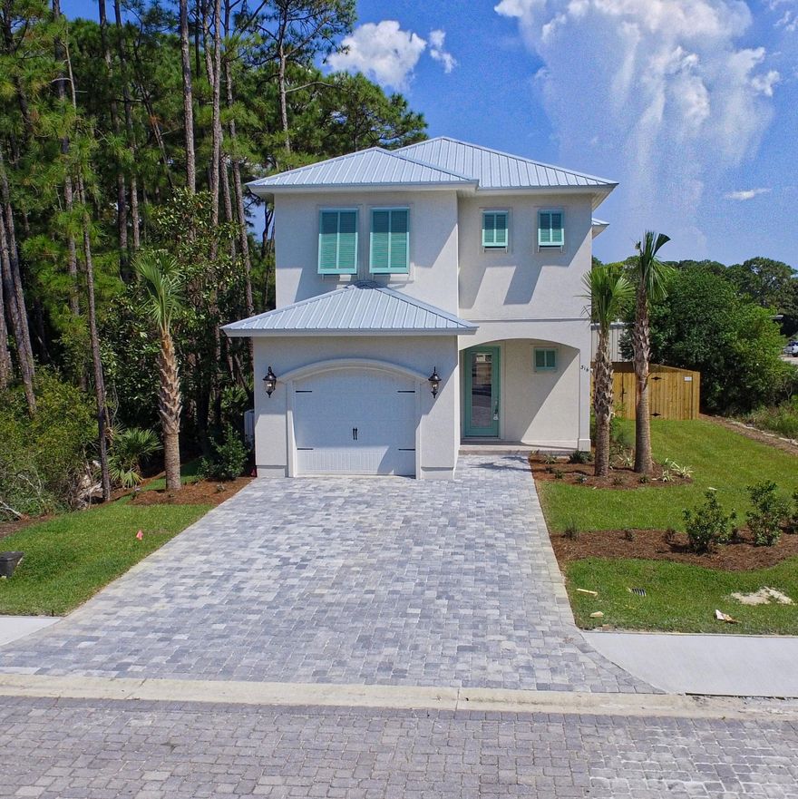 New 2,356 sq ft. four bedroom home in secure gated subdivision that is walking distance to the gulf. Home is newly completed. The beautiful community pool, clubhouse, and cobblestone roads make this a truly charming neighborhood.