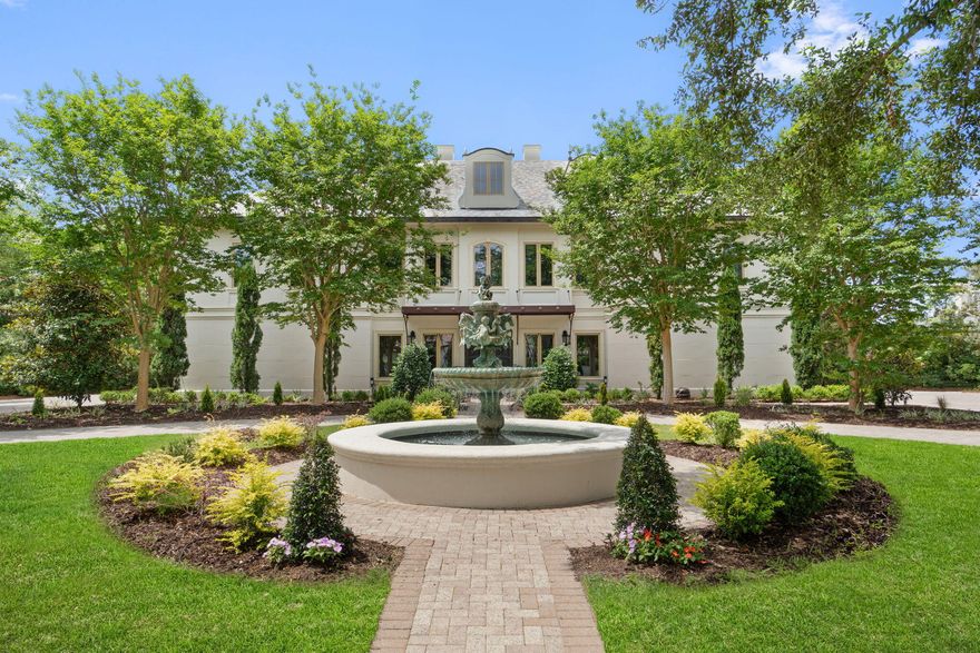 Welcome to 434 Captains Circle--an extraordinary European-inspired French Chateau, gracefully positioned within the prestigious, guard-gated enclave of Regatta Bay. This private, 24/7 secured sanctuary offers a rare blend of refined elegance and coastal serenity, meticulously crafted for both grand-scale entertaining and elevated everyday living. Set on 1.23 acres of lush, manicured grounds and constructed with ICF for enduring strength and efficiency, this custom estate is a testament to timeless design and impeccable craftsmanship. Uniquely sited right off the tranquil shores of Choctawhatchee Bay, the residence boasts over 80 feet of waterfront, framed by native sawgrass and an untouched nature preserve--offering a truly serene and picturesque backdrop. Encompassing nearly 8,000 square feet of exquisitely appointed interiors, this architectural masterpiece embodies the art of fine living, where grand proportions and classical French design converge with modern comfort. Each room has been thoughtfully curated to exude casual luxury, timeless detail, and an effortless sense of sophistication.

As you arrive at this stately estate, you're welcomed by mature, manicured landscaping and an expansive brick paver circular drive centered around an exquisite Italian fountain perfectly framing the limestone-clad fa??ade of this chateau-inspired masterpiece. Constructed with nearly 9-inch thick poured concrete exterior walls, the home offers unparalleled structural integrity and timeless grandeur. The entrance is marked by a pair of magnificent, hand-carved mahogany doors, each standing 8 feet tall, opening into a breathtaking two-story foyer crowned with a soaring 22-foot domed ceiling. A sweeping freestanding curved staircase known as the 'wedding' stair graces the space, crafted in rich wood and adorned with intricate ironwork. Italian marble columns, dual Juliette balconies, and grand architectural symmetry elevate the ambiance. Throughout the estate, natural oak hardwood floors, 10-foot ceilings, and lavish Venetian plaster walls are complemented by elaborate millwork, including 14-inch baseboards and crown moldings ranging from 8 to 14 inches each detail a testament to timeless artistry and refined craftsmanship.

Just off the grand foyer, refined functionality allows access to a tastefully appointed powder room, a private elevator, and two oversized garages accommodating up to four vehicles and/or a golf cart, complete with newly finished polyaspartic-coated floors for a sleek, durable finish. Beyond the foyer, the estate opens to expansive, light-filled living spaces framed by grand windows and elegant French doors, inviting in an abundance of natural light. The formal dining room is an entertainer's dream, currently showcasing an ornate Italian table that comfortably seats twelve beneath a custom-painted ceiling medallion and a striking Art Deco-inspired glass chandelier. The chef's kitchen is both stylish and functional, featuring refreshed custom cabinetry with sleek contemporary hardware, granite countertops and backsplash, a spacious walk-in pantry with custom shelving, a generous center island, and a separate breakfast bar. High-end appliances, including a Sub-Zero refrigerator, Thermador double ovens, Viking gas range and microwave, and more, ensure culinary perfection in every detail. Anchoring the living area is a stunning marble gas fireplace flanked by custom wood built-ins, offering warmth and timeless charm. Hidden within the home's refined design are two private studies what we fondly call its 'secrets.' One office exudes soft elegance with lighter tones, built-in bookcases, and dual French Empire crystal chandeliers, while the second office/den is richly appointed with Brazilian wood accents, intricate custom shelving, dramatic 10-foot Italian marble columns, wood-paneled walls, and wood-coffered ceilings evoking the grandeur of a European gentleman's library.

Occupying the second floor, the opulent primary suite offers a private sanctuary of sophistication and comfort. A serene balcony overlooks the pool area, while a marble-clad gas fireplace adds warmth and timeless elegance. Rare and indulgent, the suite boasts dual spa-inspired ensuites, each with its own distinct design narrative. One bath evokes a coastal serenity with soft hues of cream and blue, featuring a freestanding tub/shower, a water closet, oak wood floors, a waterfall-inspired glass sink, granite countertops, makeup vanity, custom cabinetry, and an expansive custom walk-in closet. The second bath channels a Roman-inspired ambiance with rich tan and cream tones, heated marble floors, a marble walk-in shower, private sauna, traditional single vanity, and its own custom walk-in closet. This extraordinary suite redefines luxury living with thoughtful design and unparalleled comfort.

The second level hosts three additional generously proportioned bedroom suites, each a private sanctuary featuring its own architecturally distinctive en-suite bath. Appointed with granite-topped single vanities, private water closets, and custom tiled walk-in showers (one suite also boasting a deep soaking tub) these retreats combine timeless elegance with modern comfort. Custom walk-in wardrobes complete each suite, offering both style and function. Adjacent to the bedrooms, a spacious utility room enhances daily living with custom cabinetry, granite countertops, and an oversized utility sink thoughtfully designed for seamless multitasking and refined efficiency. The third floor is devoted to a refined entertainment suite. At one end, a cozy cinema lounge adjoins a discreet half bath. The central space features a classic billiards table, while the far end offers a stylish gaming corner and bespoke wet bar ideal for relaxed, sophisticated gatherings.

The grandeur of the estate continues beyond its walls, where the outdoor living spaces are nothing short of enchanting. A private, resort-style oasis awaits within the fully enclosed lanai, elegantly finished with travertine tile flooring and centered around a spectacular 19' x 36' pool and an 8' x 8' elevated spa. A dedicated outdoor pool bath adds convenience, while every element has been thoughtfully designed for both lavish entertaining and serene relaxation. The alfresco experience is elevated by a fully appointed outdoor kitchen and bar, featuring top-of-the-line Viking and Lynx appliances, including a gas grill, gas stove, dual refrigerators, and a professional-grade pizza oven. Multiple fire features a gas fireplace with mounted television, a natural gas firepit, and a charming wood-burning firepit create inviting ambiance day or night. Extending the luxury to the water's edge, a private, 300-foot lighted pier leads to the tranquil canal just off Choctawhatchee Bay. Complete with a picturesque sitting area and dock, it offers a serene vantage point for morning coffees, sunset reflections, or effortless access to the waterway by boat completing this exceptional coastal retreat.

Thoughtfully designed for refined living, this exquisite ch??teau offers timeless elegance and effortless comfort just moments from the best of the Emerald Coast. A rare offering that must be experienced to be truly appreciated.