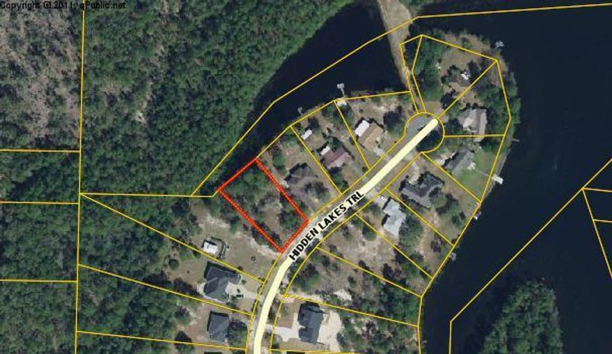 Beautiful lakefront home site in one of the nicest subdivisions in town. Lightly wooded large lot close to town and schools. Juniper Lake park , Lake Stanley Park and Wee Care Park are almost within walking distance. Beaches are less than a hour away. Underground utilities and paved street.