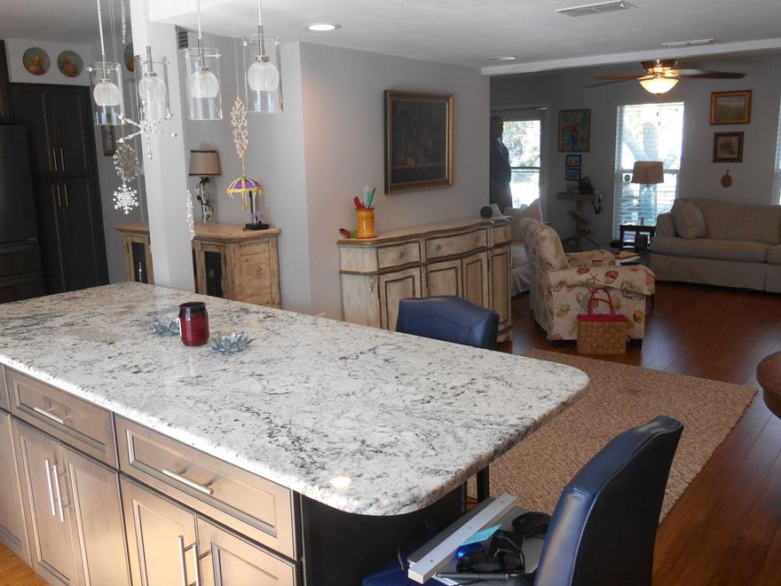 Exquisite Townhome with a Fantastic Central Location on Yacht Club Drive in Fort Walton Beach, convenient to everything and across the street from the Bayou!  Property was Fully Renovated about 5 years ago.  Features include Beautiful Bamboo Wood Floors, Stainless Steel Appliances, Designer Kitchen Cabinets with Soft-Close Drawers & Doors, Huge Isand in Kitchen with Extra Cabinets, Granite Countertops and Tile Backsplash, Updated Windows, Updated Doors, Updated Plumbing & Lighting Fixtures, HVAC Replaced in 2018, Roof Replaced in 2011.  Excellent Floorplan includes a Large Attached Single Car Garage in the Rear with Washer/Dryer.  Private Fenced-in Courtyard provides outdoor space to relax or entertain.  Upstairs, the Master Bedroom includes a Balcony where you can Catch a Glimps