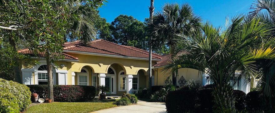 This immaculate and pristine home located on the 5th fairway of the renowned Emerald Bay Golf Course is an absolute MUST to see! As you enter the circle driveway of this Carib looking home with tons of character and lush landscaping, you will feel the warmth and amazing energy this home exuberates! As you approach the front door, you will love the large front porch and be mesmerized by all the beauty and privacy that surrounds you. Upon entering, the open foyer will lead you to an inspiring living room to welcome friends and family. This split floor plan features beautifully well-maintained pecan wood flooring, crown molding throughout, high ceilings and recessed lighting.