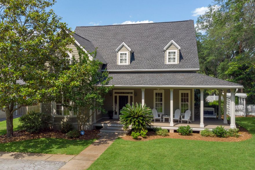 Gorgeous 4BR/4BA, 4055 SF custom home with lush landscaping and private pool. New roof, flooring, and kitchen remodel in 2021. Just a short drive from boat launch, parks, the harbor, and more. Entering this luxurious home, you are greeted with brick floors and a 30 ft tall foyer with a beautiful stairway. The first floor boasts the newly remodeled kitchen featuring stunning quartz counters with full backsplash, custom cabinets with amazing storage, spacious gourmet island, breakfast bar, five burner gas stove top, stainless steel appliances, wet bar, plantation shutters and a large dining area with bay window – perfect for entertaining guests. The living room features custom built-in cabinetry, fireplace, 100% waterproof LVP flooring, French doors leading to the covered patio and pool area. Also located on the first floor is a formal dining area, great room, bedroom with full bath and two large closets. The grand staircase leads to the second floor where there is a large Master suite with high ceiling, sitting area and huge his/her walk-in closet plus bonus walk in closet, his and her vanities, jetted tub, and separate shower. A Bedroom with walk in closet and private bath plus a spacious laundry room are also located upstairs. The loft above the garage has a 17 ft ceiling, full bath, and closet plumbed for kitchenette. The outdoor features include views of the bay, majestic live oaks, beautifully landscaped yard, with in ground Diamond Brite Onyx finished pool (plumbed for heater), jacuzzi, separate gated driveway and custom designed workshop. New A/C components in 2019 and whole house dehumidifier in 2020. Additional features include covered wrap around porch, oversized garage, two separate attics that are decked allowing for large amounts of storage space, custom interior, and exterior lighting, and private well for irrigation.