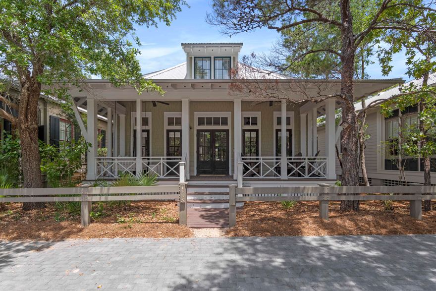 Welcome to Watercolor!  This wonderful property features wide covered porches and a distinctive coastal cottage style. Offering four bedrooms, four full bathrooms and nearly 2,100 square feet, there is ample room for entertaining with a spacious, open concept living and dining area highlighted by custom millwork and newly refinished wood floors. An outstanding location allows you to make the most of the carefree Watercolor lifestyle with the redesigned Camp Watercolor, complete with lazy river and waterslide, just a stroll away as well as the nearby tennis center and a tree filled park across the street. A lovely first-story master suite offers privacy while the three guest rooms, all with ensuite baths, let you comfortably sleep a crowd, with one room providing four built-in bunks.