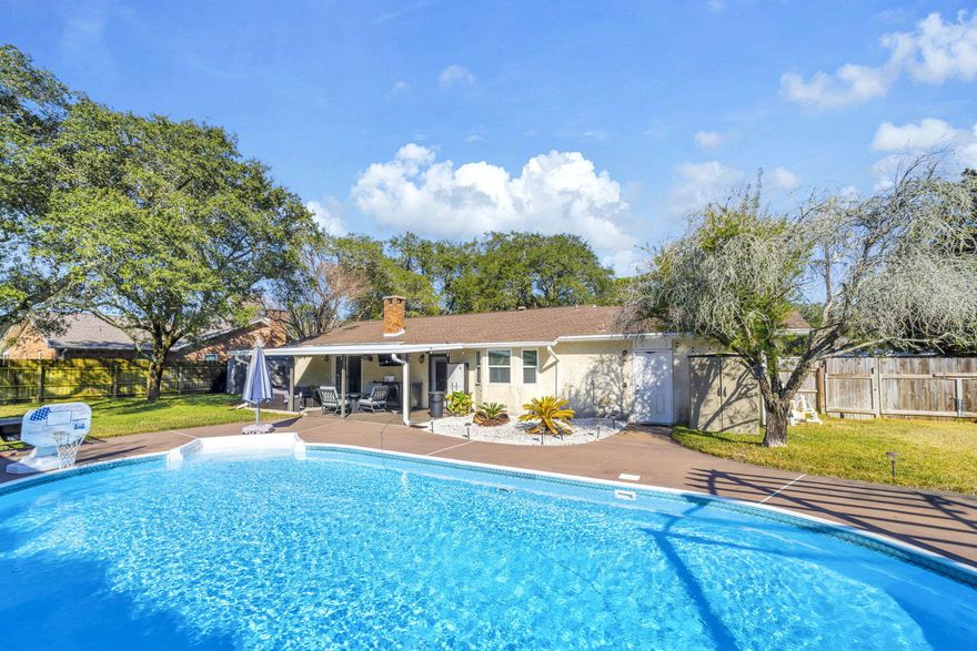 If a private backyard and poolside living are at the top of your wish list, this home delivers. Designed for outdoor enjoyment, the fully fenced backyard is a true retreat featuring a large in-ground pool, two covered gazebos for shade and entertaining, and a covered back porch perfect for lounging, dining, or hosting unforgettable summer gatherings. Mature camellia shrubs create a lush, private setting that feels like your own personal resort.Inside, this charming Mediterranean-style 3 bedroom, 2 bath home offers comfort and functionality with a kitchen and breakfast nook overlooking the outdoor space, plus a separate dining room for entertaining. The living area is anchored by a gas fireplace, adding warmth and character, while tasteful updates throughout the kitchen and baths  enhance everyday living. 

Major improvements add peace of mind so you can focus on enjoying the pool lifestyle: new microwave(2022), new roof (2021), HVAC (2021), garbage disposal (2020), new pool pump and filter (2023), and a smart hybrid electric water heater (2023). Additional features include a Ring doorbell and a transferable termite bond through Florida Pest Control.
This home is all about relaxation, entertaining, and making the most of outdoor living...a rare opportunity for buyers who want a backyard that truly steals the show.