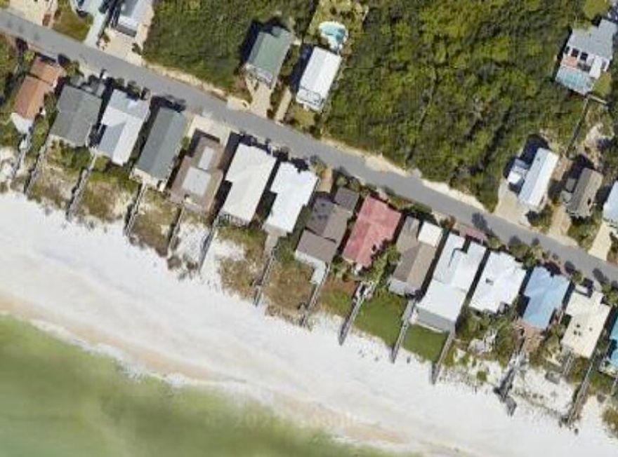 Two Forty Sand Cliffs Drive is an exceptionally unique and newly redesigned Gulf front residence by architect Matt Savoie and builder Jared Smartt of Earthbuild. The home is located on the east end of 30 A in the exclusive non-rental community of Sand Cliffs. When entering the private gated community you will be greeted with lush landscaping and the old Florida feel of this quaint gulf front community. Upon arriving at the Mediterranean styled 'Santa Barbara' beach home you will find the exterior has been completely refinished with all new stucco, new windows and doors, along with stunning landscaping surrounding the home. As you enter the home your eyes are immediately drawn to the large floor to ceiling glass with east to west views of the Gulf through the south side of the residence. With a completely new look this home has been renovated to suit a luxury beachfront lifestyle. With a long list of upgraded features;  beautiful wood beams, heated hardwood floors throughout, a newly designed gourmet chef's kitchen, open shelving, custom cabinetry, quartzite countertops, large double sub zero refrigerator, and a walk-in pantry just to name a few. The endless views of the Gulf can be enjoyed from the open concept living areas as well as the primary bedroom. This home has three large bedroom suites all with private ensuite, the primary is gulf front with an incredibly gorgeous ensuite with a separate soaking tub and large steam shower. As you walk through the home you will notice all new lift and slide doors across the entire back of the home accentuating the views of the gulf front salt water pool and spa. This home is all about outdoor living with a large deck, outdoor grilling, and a lounging area for amazing sunsets. Sand Cliffs community is an exceptional private retreat tucked away just off Watersound Parkway and directly adjacent to Kaiya and Alys Beach Resorts within walking distance to all they have to offer.