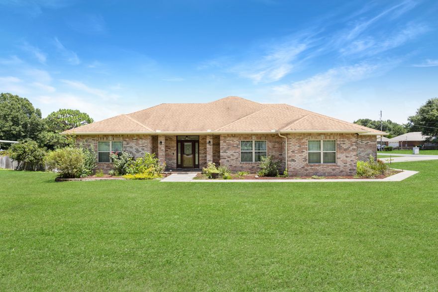 Motivated seller so don't miss out on this beautiful brick home and most rooms overlook the lake. Spacious family room/great room leads out to the screened porch which is good for entertaining or just relaxing. Kitchen has loads of cabinets and counter space with a lite pantry. Bedrooms can easily accommodate large furniture and all have ample closet space. Master bedroom has 2 closets and walk in shower. There is a Manabloc plumbing system and the water heater is a hybrid model. The garage will accommodate 2 vehicles and there is a cooled workshop/garage (19x24) attached to the main garage. Was used as a workshop.  All this home needs is your personal touches !