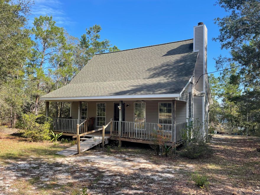 LAKE HOUSE + THE BEACH!!   Discover a 2 bedroom 2 story cottage with a stretch of waterfront on the Lake! What a great find on 4.5 private acres at the end of a quiet road in a small community of single family homes. The home has a 2nd story loft bedroom overlooking the great room.  A great room with a gorgeous wood lined ceiling. A porch off the front and one off the back overlooking the lake. The home is located 40 minutes north of Panama City Beach and south of I-10. The views are spectacular and the great outdoors invite you to relax and enjoy a Lake House Lifestyle. Planning a Day at the beach? It's an easy drive to the white sands and blue green waters of the Gulf of Mexico.*Vernon elementary, *Vernon middle *Vernon high school.