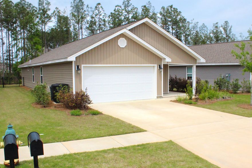 BEST PRICED HOME IN HAMMOCK BAY! Built in 2019 and practically brand new. This wonderful Jemison floor plan offers 3 bedrooms, 2 baths, over 1600 square feet, 2 car garage with room for storage and a true open kitchen/living floor plan. Perfect for young families, singles, or someone looking to downsize. Kitchen features  an island that easily sits 3 people, stainless steel appliances, pantry and plenty of cabinets for all your cooking needs. The living area has double french doors that lead out to a relaxing screened in back porch. Great area to enjoy your morning coffee, unwind or entertain family and friends. The well manicured yard is perfect for children and pets to safely play and even gardening. The large master bedroom is located in the back of the home off of the living room