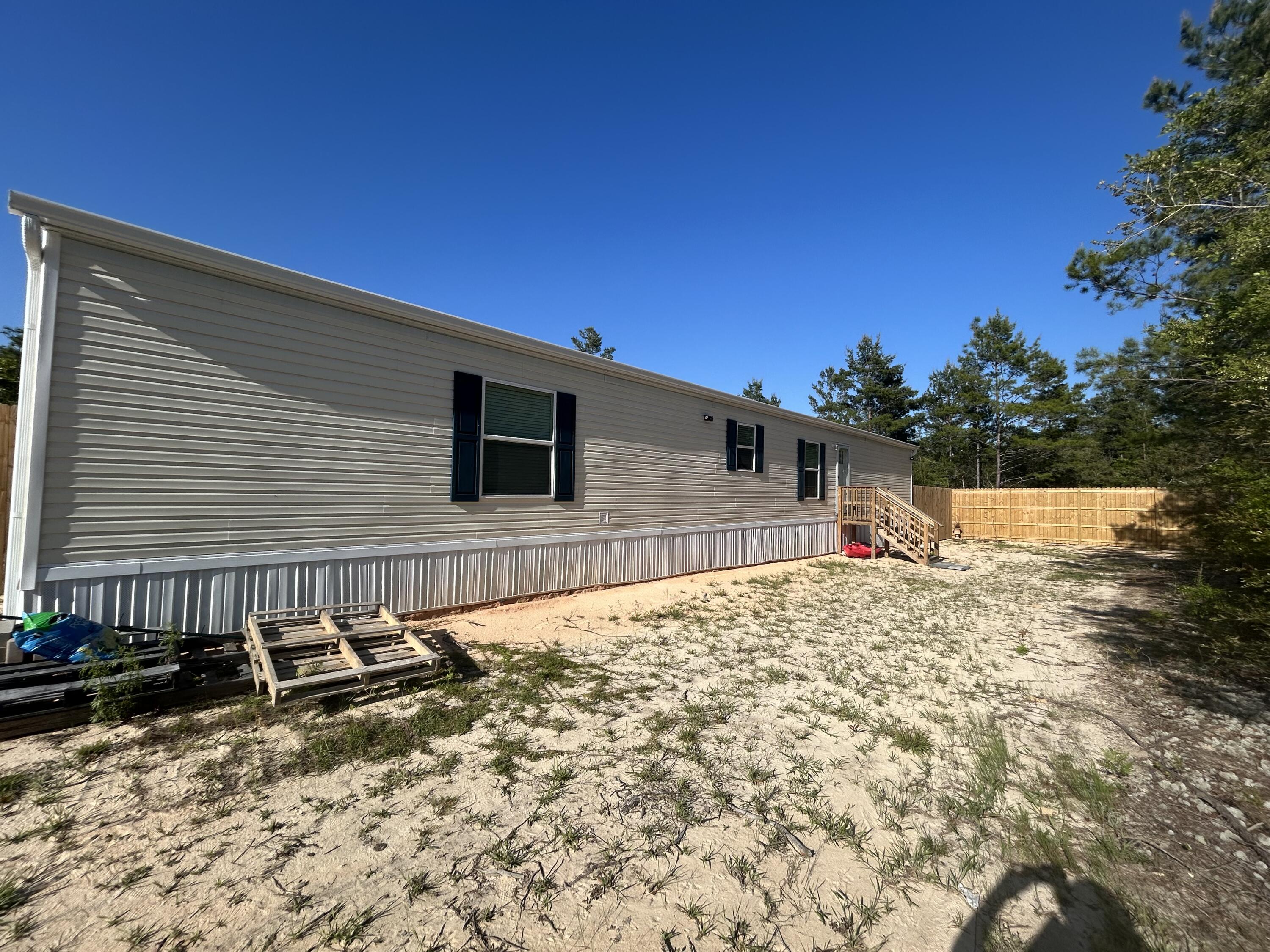 Now available for lease--18 Daffodil Circle! This brand new 2024 manufactured home offers 3 bedrooms, 2 bathrooms, and just under 1,200 square feet of thoughtfully designed living space. The split floor plan provides privacy, while the open-concept layout creates a warm and inviting atmosphere. Enjoy a spacious living area, a modern kitchen, a private primary suite with an en-suite bathroom, and a tucked-away utility room for added convenience. With energy-efficient features and stylish finishes throughout, this home is move-in ready and perfectly situated in a quiet, convenient location. Don't miss your chance to call this beautiful home yours--schedule your showing today!