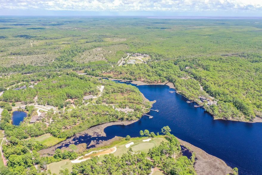 An incredible opportunity awaits in this 734-acre Coastal Sanctuary of Wild Heron to build your WATERFRONT dream home. On the shores of Lake Powell sits a pristine 1.26 acre piece of vacant land that is bordered by conservation area and with the purest of sunset views. This culdesac features only two parcels to ensure the greatest amount of privacy for your dream estate. Wild Heron is a gated community with a community pool, boathouse, fitness center and trails all with tranquility and natural landscaping. Wild Heron is also home to Shark's Tooth Golf Club of the private Watersound Club, which is an 18-hole championship golf course designed by Greg Norman. Just minutes from the dining, shops and beautiful beaches of 30A and Panama City Beach, Wild Heron is in a prime location.