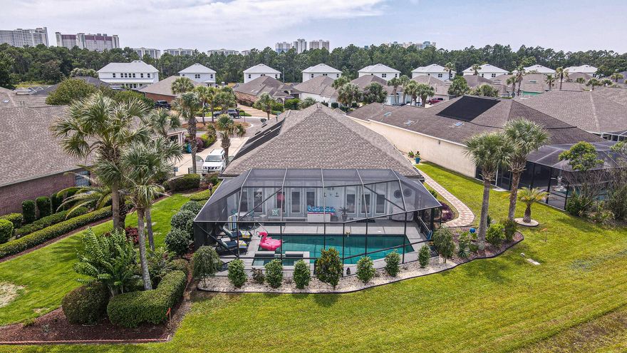 Watch breathtaking sunrises and sunsets from your beautiful, screened- in, heated pool and hot tub.  Nestled in the middle of everything Panama City Beach has to offer, is this one-of-a-kind 3bedroom (& office), 2.5 bath home in the exclusive gated neighborhood of Tierra Verde.  Sitting less than 1 mile from the beautiful blue waters, .7 miles from the highly anticipated Duplin Winery and 5.4 miles to the premier destination known as Pier Park this home is all about LOCATION, LOCATION, LOCATION! Pier park offers shops, dining, free open air-concerts & festivals throughout the year!  Enjoy ALL the area attractions and come home to 20' tray ceilings, triple crown molding, new roof & lanai in 2019 and a completely remodel of a spa like master bath just to name a few of the many renovations!!