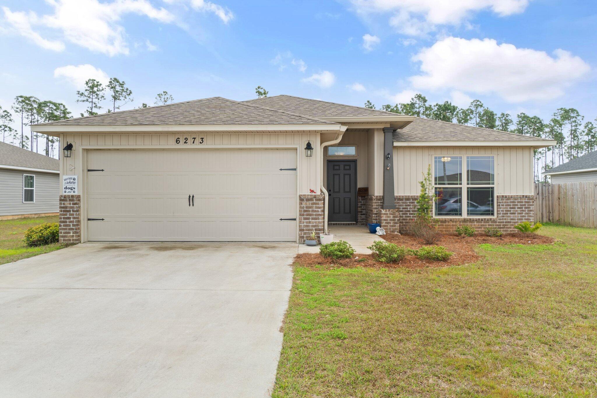 Introducing this 2021-built home nestled in the serene Heather's Place neighborhood. Boasting 3 bedrooms and 2 bathrooms, this home offers a fenced backyard with dual entry points, including a double gate. Inside, revel in the absence of carpet across the split floor plan, open-concept layout. The kitchen is adorned with stainless appliances, granite countertops, an island with storage, & a convenient bar for entertaining. Adjacent is the dining area, featuring elegant French doors that flood the space with natural light and provide scenic views of the expansive backyard. The primary bedroom boasts a trey ceiling, ensuite bathroom with a tiled walk-in shower and soaking tub, and an ample walk-in closet. Conveniently located just a short drive from Gulf Breeze zoo and stunning beaches.