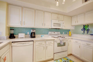If you've been looking for your slice of Paradise you will have found it when you reach at the end of the road. This Two bedroom Condo is ready for you to make your home away from home get away or your extra income investment. Either way you choose to use this breath of fresh air light and lively space. You will find everything you need. From the fully stocked Kitchen to prepare those wonderful meals to share with family on the Balcony. Or Enjoy a great movie night in the living room or maybe a family card game a the dining table. You have room to do it all after a great day at the beach and still enjoy a night swim at either of the two pools. Maybe game of Tennis. It could be just a stroll along the sugar white sandy beach to end the perfect day. The Perfect choice Starts Here!!!!!
