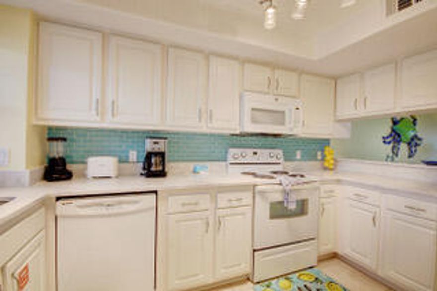 If you've been looking for your slice of Paradise you will have found it when you reach at the end of the road. This Two bedroom Condo is ready for you to make your home away from home get away or your extra income investment. Either way you choose to use this breath of fresh air light and lively space. You will find everything you need. From the fully stocked Kitchen to prepare those wonderful meals to share with family on the Balcony. Or Enjoy a great movie night in the living room or maybe  a family card game a the dining table. You have room to do it all after a great day at the beach and still enjoy a night swim at either of the two pools. Maybe game of Tennis. It could be just a stroll along the sugar white sandy beach to end the perfect day. The Perfect choice Starts Here!!!!! Tank, New Windows that let you see a direct view of the Gulf not to mention you can see a view of the sound from the front windows out the kitchen. It could be just a stroll along the sugar white sandy beach to end the perfect day. The Perfect Choice is yours to make and  it Starts Here!!!!