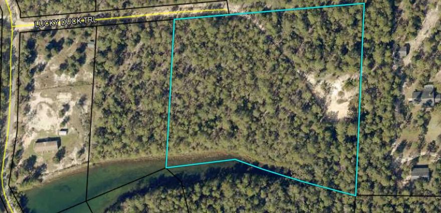 This slightly sloped wooded parcel sits at the East end of the lake and the subsequent pond that is fed by the lake. The elevation of this parcel would provide a great Westerly view for amazing sunsets. Bring your home plans and begin to make your homebuilding  dreams come true.