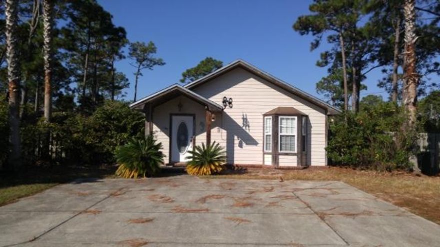 This darling Florida Cottage has been used as a second home cottage when visiting family. It has a large corner lot. An addition for the washer and dryer was added, the back yard is almost completely fenced. There is a back porch and a fire pit. Sold unfurnished so you can add your touch.