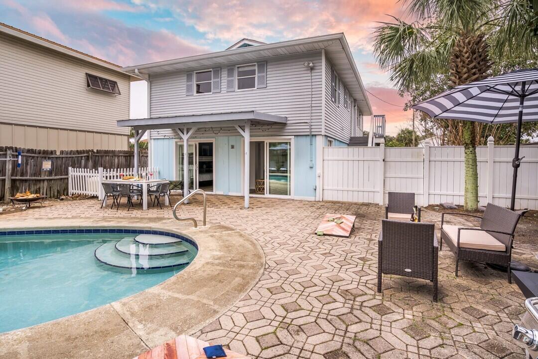 Welcome to 92 Tarpon Street - a beautifully maintained and inviting home that blends comfort, charm, and coastal living. This stunning 4 bedroom and 4 bathroom property offers spacious living areas, a modern kitchen with updated appliances, and light-filled rooms throughout. Whether you're enjoying the light filled sunroom, relaxing in the private backyard, or entertaining guests in the open-concept living space, this home provides the perfect backdrop for everyday living or vacation getaways. Ideally situated in the desirable Crystal Beach neighborhood, just TWO blocks from the beach, close to shops, and local dining, 92 Tarpon St is a rare find that combines lifestyle and location!
