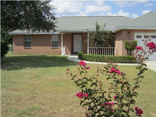 This gorgeous brick home is located on the south side of I-10. The back yard is chain link all the way down to the LAKE ! Attic area has plywood decking over a 2 car garage for plenty of storage. Garage is also drywall & painted. Tile is ''old world'' terra cotta floor tiles, hardwood flooring is cherry. Master bath has oversized shower with dual shower heads and cultured marble floor to ceiling also a 12-jet Jacuzzi whirlpool bathtub. Large well maintained home with lots of upgrades. Enjoy lots of outdoor BBQ's or family entertaining on the large 16' x 12' deck with a beautiful view of the Lake. New roof 2010. Replaced AC in 2007.