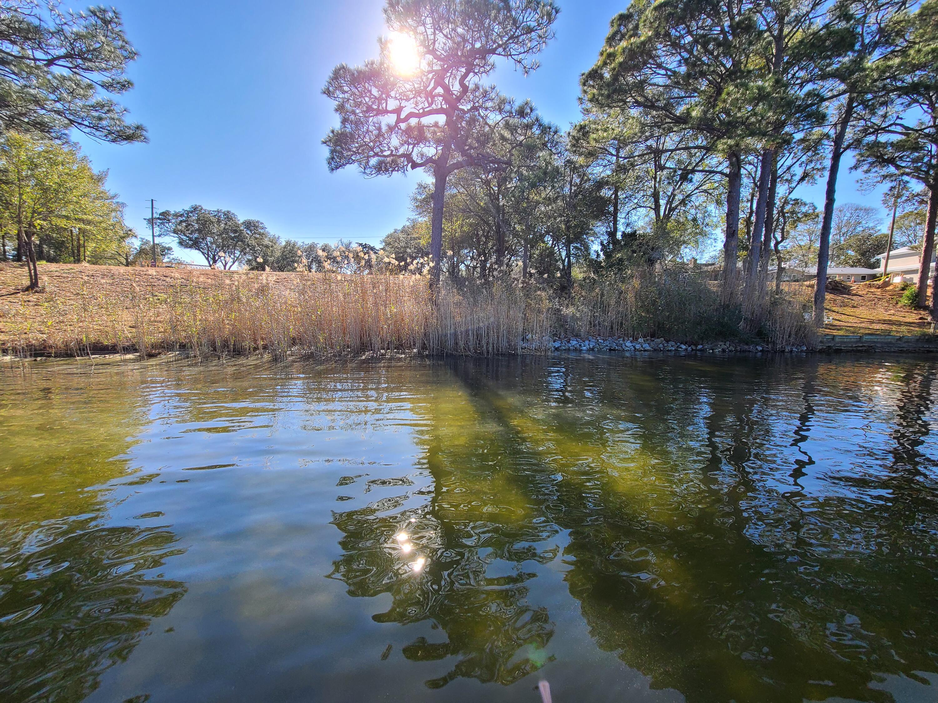 Extraordinary opportunity to own one of the few remaining waterfront and water-view lots in Valparaiso, FL.Two separate lots, sold as ''one'' parcel. They are located on a quiet street, with a stunning view of Tom's bayou. These beautiful lots have potential to make it a perfect homesite for full time residents or second homeowners. It's the hidden gem of a neighborhood, no HOA, no restrictions! Vacant lots of this scale and caliber are nearly non-existent in the local market! Please inquire for further details.Buyer to perform their own due diligence.