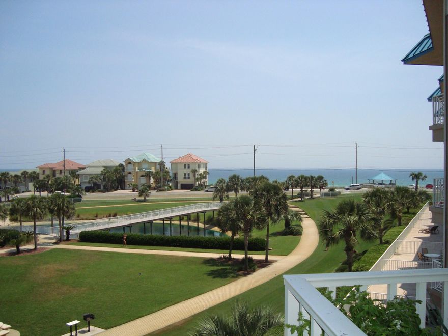 AMALFI COAST IS A CONCRETE AND STEEL CONSTRUCTED COMPLEX WITH APPROVED FIXED 30 YEAR FANNIE MAE FINANCING! Visit the virtual tour -click photos. This owner occupied 3rd floor end unit has breathtaking views of the Gulf and the grounds. Upgraded with bamboo wood flooring. Two master suites. Large walk in laundry room with cabinets and storage closet. Dedicated Garage parking plus locked storage. Amalfi Coast features 8.6 manicured acres, gated and fenced with grilling areas scattered around the grounds.360 Ft of unobstructed Gulf front with Gazebo and beach service. Fitness center, community room, 2 pools - one heated, 2 lighted tennis courts and basketball. Pet friendly for owners.