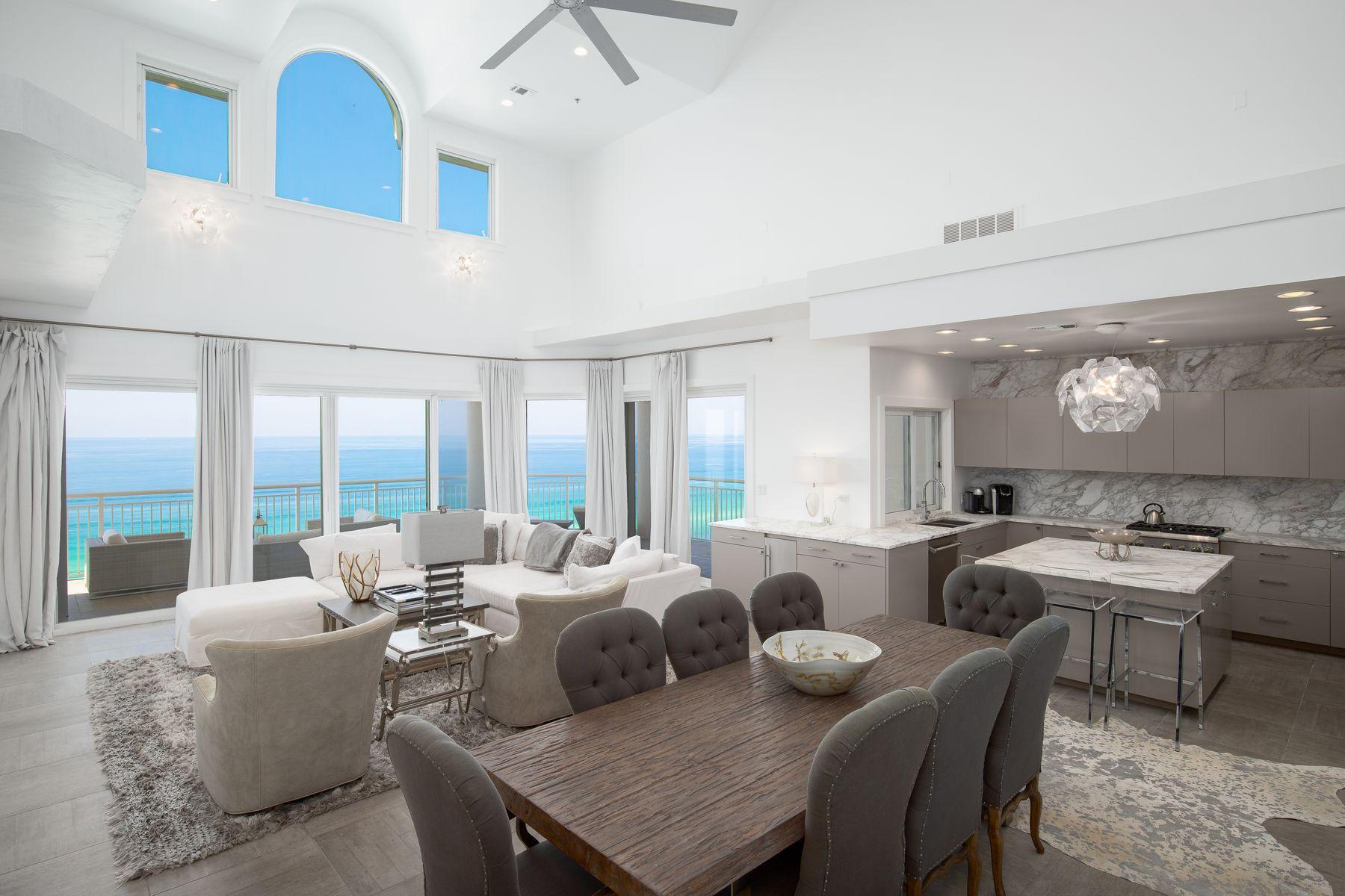 An aspirational gulf-front lifestyle awaits in this modern 6-bedroom penthouse condo in Hidden Dunes, a luxurious gated resort in Miramar Beach, Florida. This two-story beachfront property boasts double-height ceilings in the living room and awesome gulf views. High-end furnishings and a tasteful modern finish are present throughout this completely remodeled bespoke condo. The design goes beyond the norm with grey-and-white marbled walls and counter-tops in the gourmet kitchen and throughout the master bath. The living space is complemented by walls of glass doors that lead to a wrap-around balcony space for maximizing the breathtaking panoramic views of the sparkling emerald gulf, particularly at sunset.Hidden Dunes is a spectacular gated beachfront resort on 27 acres with walking paths winding through natural vegetation connecting cascading fountains, four pools, and fun sports courts include pickle ball courts, horseshoe pits and a lighted basketball court for playing in the cooler evening air. Owners enjoy swimming and relaxing in the amazing gulf-front pool and spa on expansive decks complete with entertainment bar and ice maker. A convenient walkway leads directly to the private deeded beach with chair and umbrella service. This rental-restricted community includes private security, a state-of-the-art fitness center, covered parking garages, and a grand community room for social events.