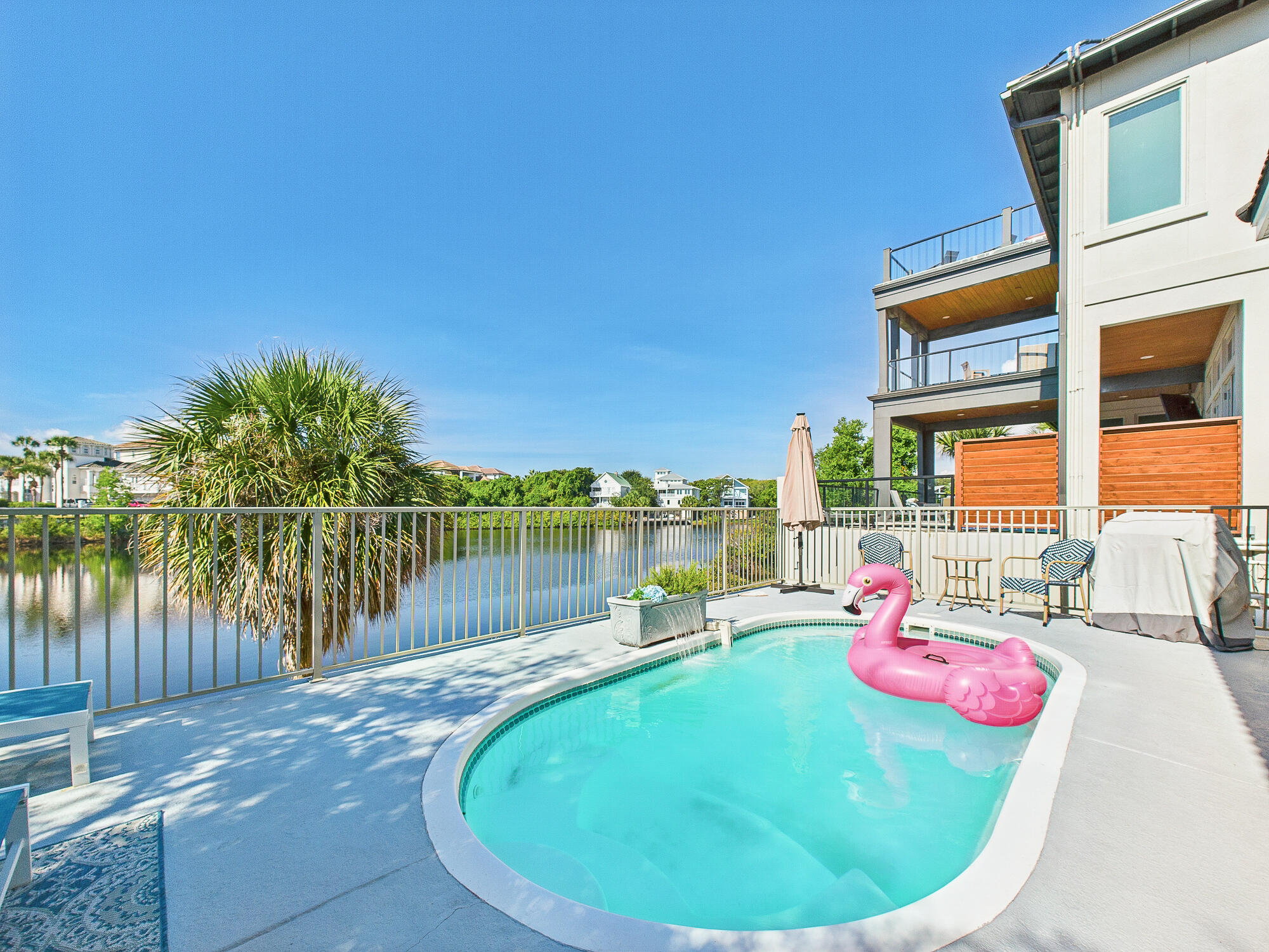 Welcome to a majestic 2674 sq. ft. three-story beach house perfectly nestled within Destin's premium beachside locale, just off the Scenic Highway 98. This exquisite lakefront retreat tucked inside the exclusive, gated community of Destiny effortlessly blends luxury living, vacation charm, and immense investment potential.Boasting the capacity to comfortably accommodate up to 15 guests, this beach house is an immaculate gem. The first floor contains a grand primary suite, complete with a king-sized bed, a charming twin daybed, a spa-styled bath, plus direct access to the private saltwater pool. Enjoy the airy open-plan living room with a fireplace and built-in shelves. The chef's kitchen is a culinary dream accentuated by the shining granite counters and stainless steel .... stainless-steel appliances.
Ascend to the second floor to discover a comfortable bunk alcove, two spacious bedrooms, one furnished with a king-sized bed and the other featuring two queen beds, interlinked by a convenient Jack & Jill bath.
The uppermost floor reveals an enchanting loft housing twin daybeds and captivating lake and gulf views. Herein, you'll also find a handy kitchenette perfect for quiet, intimate moments.
Outdoors, indulge in your private above ground pool terrace overlooking the lake or spoil yourself with Destiny's resort amenities: the lagoon, hot tub, tennis courts, fitness center, and clubhouse. All these are directly opposite the picturesque James Lee Park beach access, known for its pristine white sands and calming emerald green waters.
Recent upgrades include:
2 new HVAC units installed Mar 25 with warranty included
Roof replaced in 2017 with top grade materials
2nd floor has new carpeting and stairs are now wood
Newly renovated kitchen with all new cabinetry, stainless steel appliances, granite counters, and detailed lighting
Recently installed wood look tile floors throughout the main living level
Newly remodeled master bathroom with beautifully tiled walk-in shower, separate soaking tub and double vanities plus a HUGE walk-in closet
New full bath addition on main level with beautiful tiled walk-in shower.
Added perks include extra-large closets in the primary bedroom and a spacious walk-in closet in the primary bath. This property also comes fully furnished and ready for immediate enjoyment or high-yield rental income potential.
Schedule a showing or contact us today for more information on this irresistible lakefront retreat. Your dream home patiently awaits at 4634 Sunset Pointe!