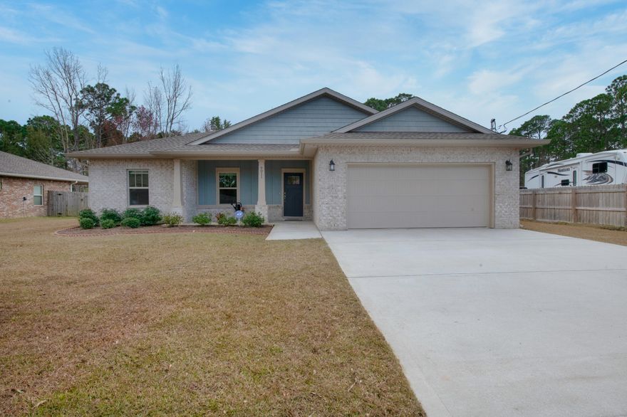 Welcome to your beautiful like new Craftsman style home. Step inside and be greeted by the spacious open floor plan with grey wood laminate flooring and crown molding. The tiled kitchen is equipped with stainless steel appliances, granite countertops, soft close drawers, and large island with plenty of counter dining space. The master bedroom is located just off the kitchen/dining area and will easily accommodate many king sized bedroom sets. The private master bathroom features a large walk-in tile shower, garden tub, and dual granite vanity. The custom master walk in closet has direct access to the oversized laundry room with dual entry. Relax out back and watch the birds from your screened in porch.  Located just 8 minutes from the white sandy beaches and 14 minutes from Hurlburt Field.
