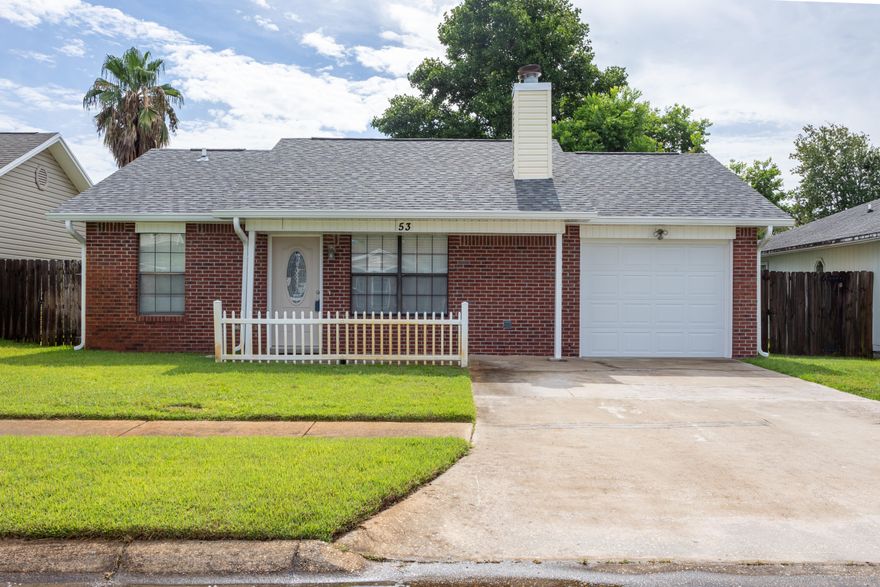 This charming home is ideally located near elementary, middle, and high schools, making it a great option for families with school-aged children. There are sidewalks throughout the neighborhood offering a stroll or bike ride to nearby amenities.  This property is also convenient to Hurlburt Field, Eglin Air Force Base and Duke Field.  Along with dining, shopping, waterfront park and beaches, come experience the comfort and convenience that this home has to offer! Inside, you'll find three bedrooms with walk-in closets, two bathrooms, interior laundry and a large living room providing ample space for both relaxation and privacy.  The cozy fireplace adds a touch of warmth and ambiance, making it the perfect spot to gather with loved ones during cooler evenings. While the attached....... one-car garage offers convenience and additional storage options.  The kitchen has a brand-new stove and refrigerator.  Other recent updates include a new roof, water heater, electrical panel, and hurricane shutters, providing both peace of mind and increased energy efficiency and better insurance premiums. The addition of a hurricane garage door and fireplace cap adds an extra layer of protection and safety to the home. The presence of sprinklers ensures that the lush green lawn and landscaping are maintained effortlessly, while the open wood deck just off the kitchen provides the perfect spot to relax and enjoy the Florida sunshine. The privacy-fenced backyard offers a serene and secluded retreat, ideal for outdoor activities or entertaining. Whether you're hosting a barbecue or enjoying a quiet evening under the stars, this backyard oasis is sure to impress.