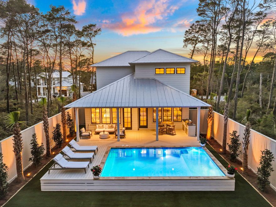 Welcome to your slice of paradise in the prestigious Lakeside community of Inlet Beach, where luxury meets coastal charm. This stunning home, professionally decorated by the talented interior design team at Oak & Anchor and newly constructed by the distinguished team at Focus Construction, boasts an array of upscale features and thoughtful touches throughout.Step inside to discover a seamless blend of elegance and comfort, where expansive ceilings in the main living area create a grand sense of space and airiness. Cypress wood accent ceilings and hardwood floors further enhance the ambiance, offering warmth and sophistication. The gourmet kitchen is a chef's delight, equipped with top-of-the-line KitchenAid appliances, custom cabinets, and sleek black accent hardware.