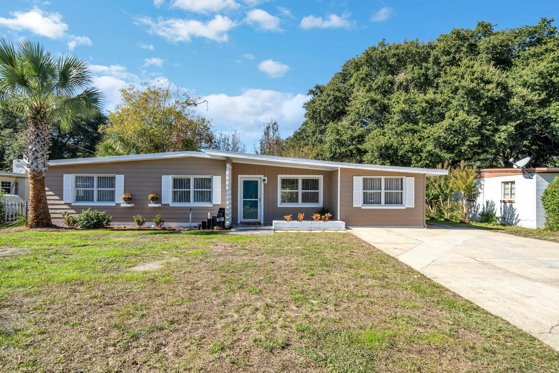 LOCATION! LOCATION! LOCATION! Fort Walton Beach's most sought after neighborhood. No detail was overlooked in this beautiful remodeled 4 bedroom/ 2 bath home located in the heart of Elliot Point, walking distance to Elliot Point Elementary school and Ferry Park. Conveniently located to the Beaches, Community boat launch, Uptown Station, Publix, and Golf Cart friendly to downtown dining and entertainment. This home offers a huge 288 sq ft Florida Room with wrap around windows which allow plenty of daylight. A lockout room with full bathroom that includes a separate entrance. A detached Garage and separate detached Cottage. Oversized parking area with RV hook up. Irrigation/well and lush mature landscaping create a private and tranquil backyard setting for plenty of relaxation.