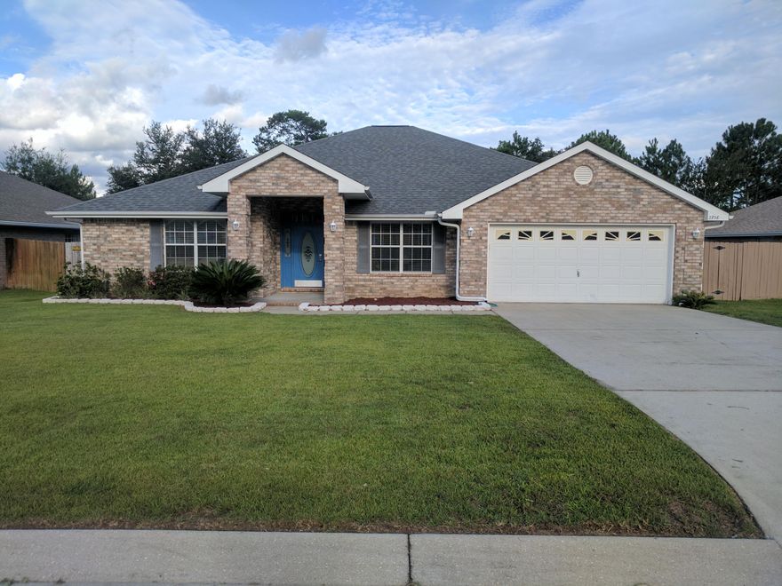 Beautiful one story brick home with many upgrades. Tile and Hardwood throughout. Upgraded within one year are; gutters, stainless appliances, garbage disposal, bathroom faucet. New ceiling fans in all rooms and supply lines to toilets and sinks. Located in a quiet community close to Navarre Beach, Gulf Breeze and Pensacola. Completely private backyard with a private wooded area in the rear. Modern and Open floor plan. Four bedrooms and three full baths. A MUST SEE!!!