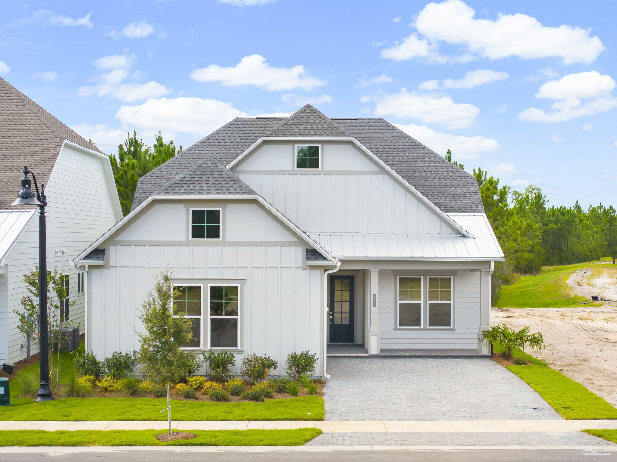 **NEW CONSTRUCTION**Located in Salt Grass at Ward Creek. Home will be available in August 2025. Model photos used for reference. Welcome to the Lila floor plan, a Kolter Homes built home that blends modern elegance with comfort and durability. This 4-Bedroom, 3 Bath residence features a 2-Car courtyard garage, charming front porch, and paver driveway. Engineered to exceed current Florida Building code standards. This home includes 2x6 exterior walls, impact- resistance windows, and James Hardie sliding for long lasting quality and peace of mind. Inside, soaring tray ceilings create an open elevated atmosphere. The gourmet kitchen is the heart of the home, boasting designer selected finishes such as an expansive island, quartz countertops, brushed nickel hardware, and GE Profile appliances. The owner's suite offers a luxurious retreat, featuring a frameless walk-in shower with bult in seating. Throughout the home rich hardwood flooring adds a seamless and sophisticated touch. Outdoors, large homesites provide ample room for personalized outdoor living. This home also backs up to protected Florida wilderness, offering serene preserve views and exceptional privacy. Located in the sought-after Saltgrass at Ward Creek community, this home places you just minutes from all that Panama City has to offer- without the congestion. Enjoy quick access to 30A beaches, Pier Park, Top Golf, and a vibrant array of shopping and dining. Saltgrass is also positioned near exciting new developments, including the 87-acre THH?FSU Hospital, the upcoming West Bay Shopping Center with 50,000+ sq ft of retail space, a Publix, expected to open in Spring 2026. Whether you're looking for elegance, space, or an unbeatable location, the Lila delivers it all.